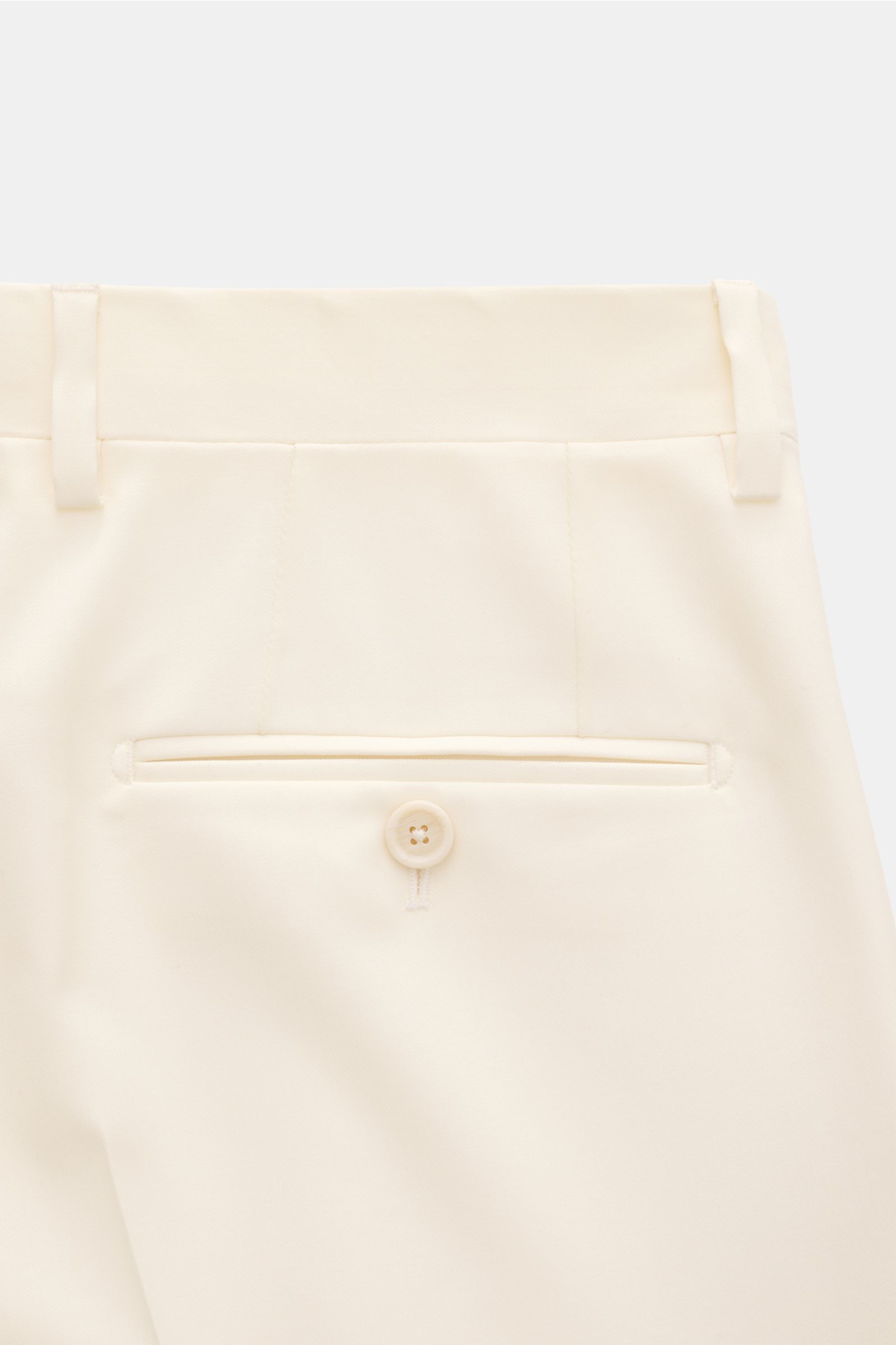 Close-up rear view of Lardini Anzug creme trousers in pure virgin wool, showing buttoned back pocket and soft fabric texture.