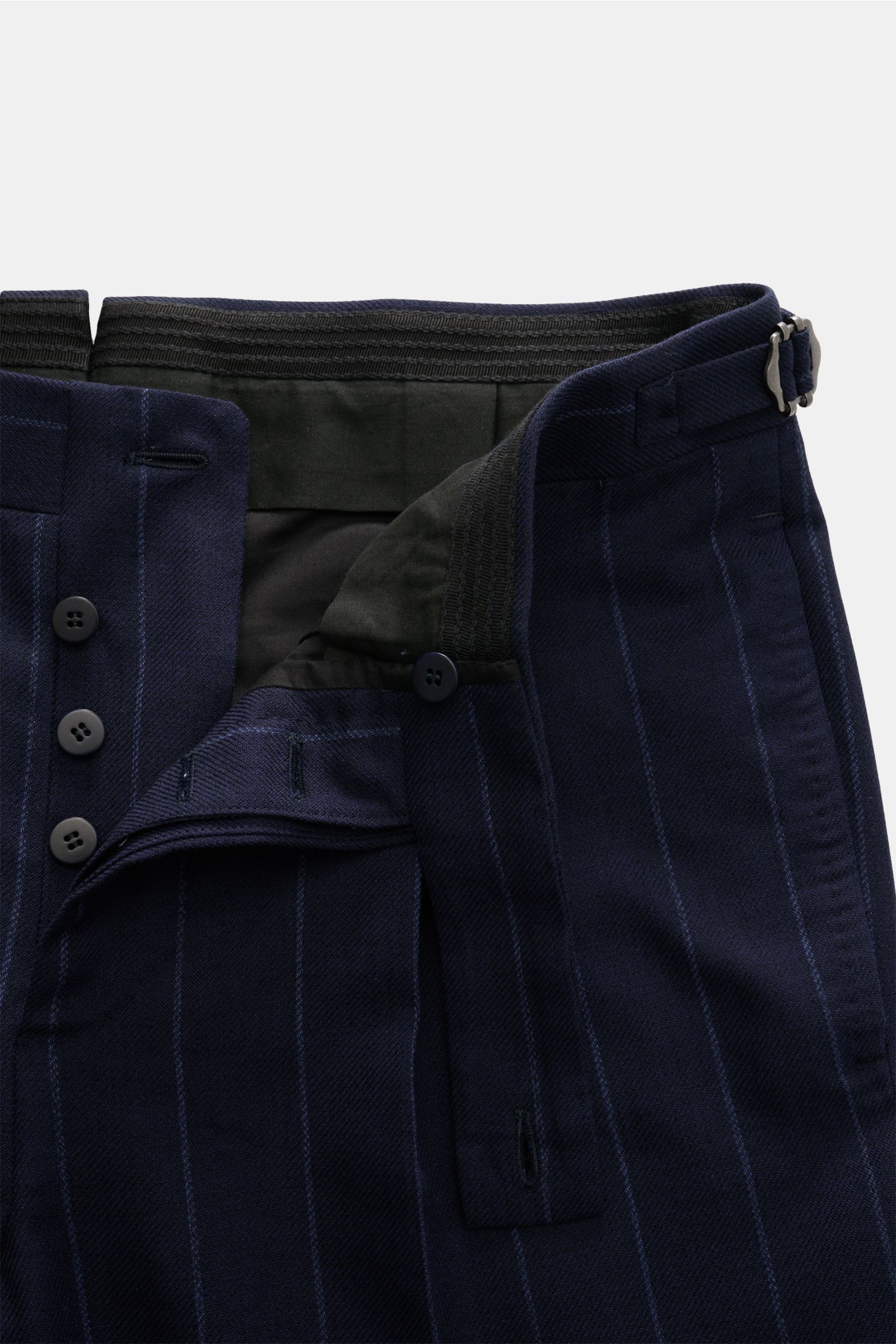 Close-up front view of Stile Latino Anzug 'Vincenzo' navy gestreift trousers showing button fly, side-adjuster, and fine navy chalk stripes.