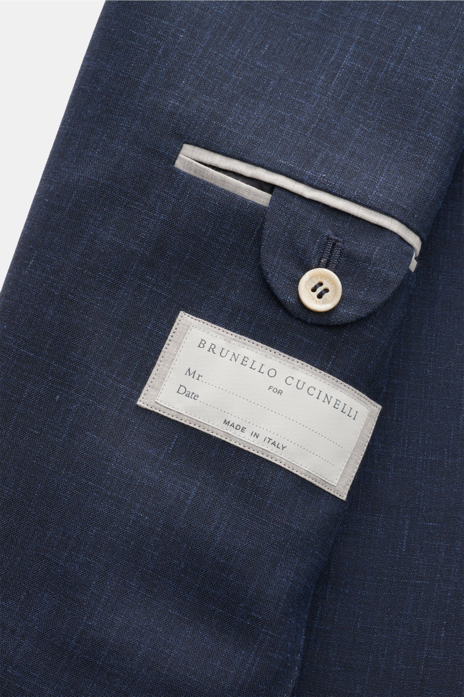 Close-up front view of the Brunello Cucinelli Anzug navy meliert jacket sleeve, showing detailed stitching, button, and label 'Made in Italy'.
