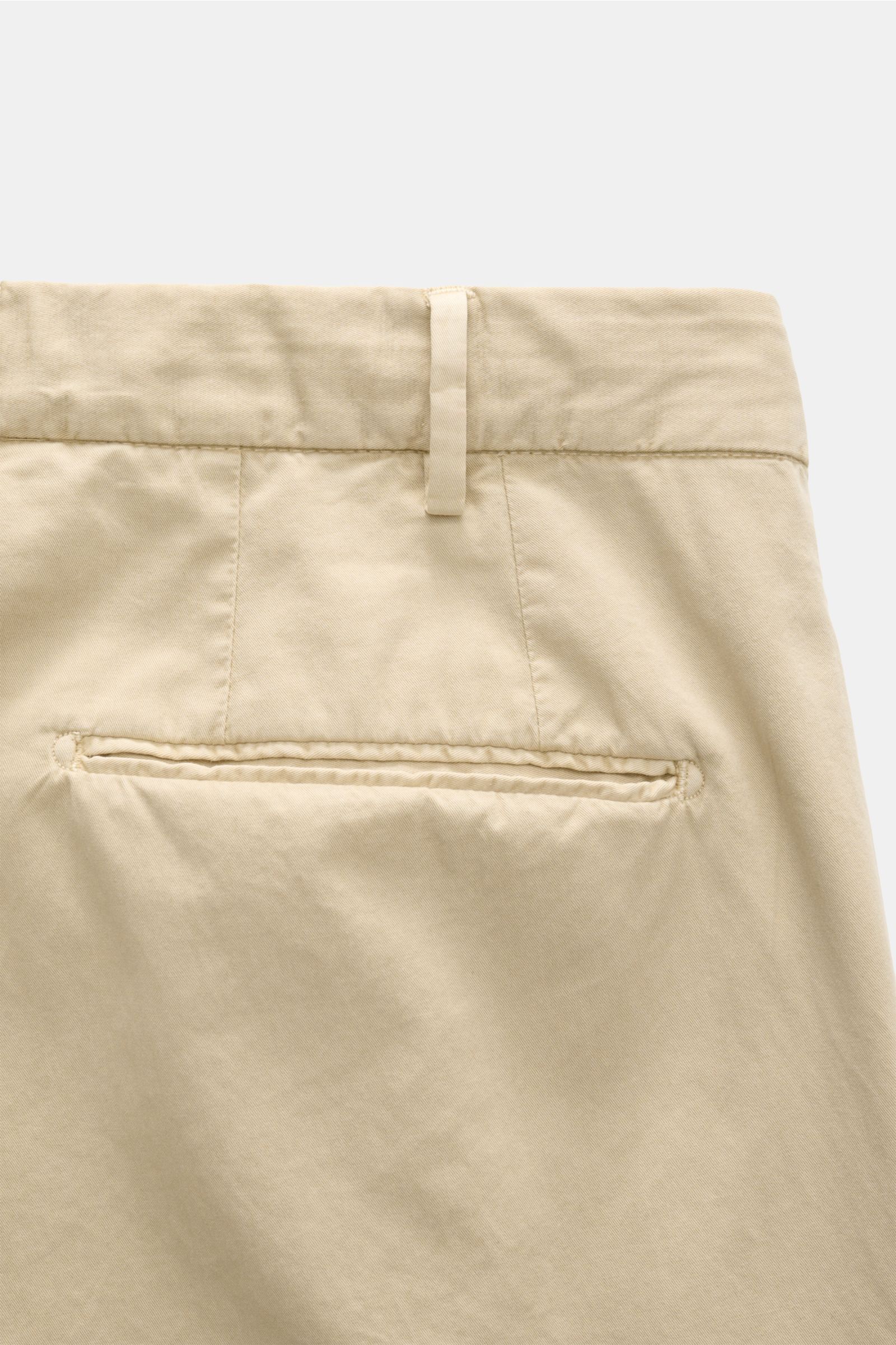 Close-up rear view of the Santaniello Anzug sand trousers in soft pure cotton twill, showing slim fit and welt pocket details.