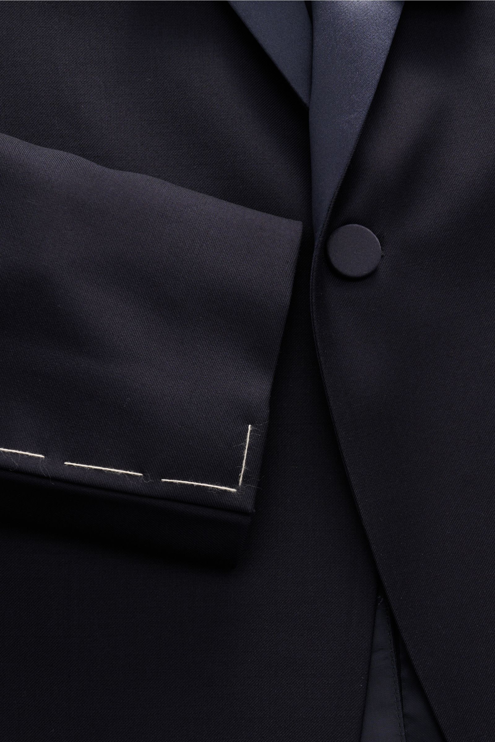Close-up front view of the Tagliatore Tuxedo navy showing the slim fit, one-button jacket in pure Super 110'S virgin wool with satin lapel.