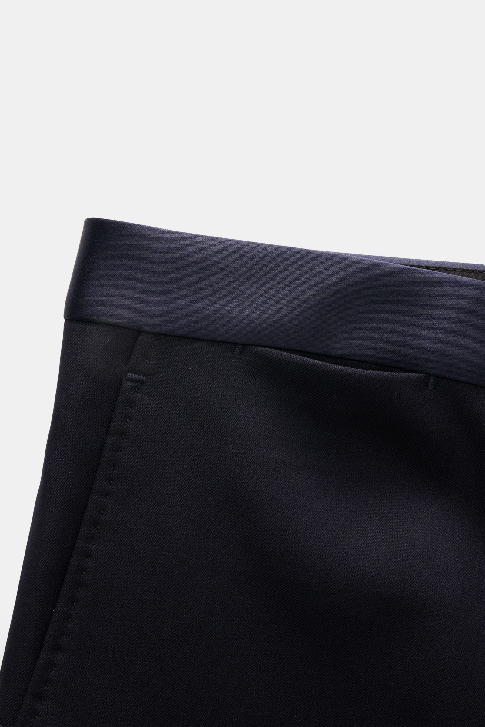 Navy satin waistband detail of Tagliatore Tuxedo navy trousers, photographed close-up from the top front angle.