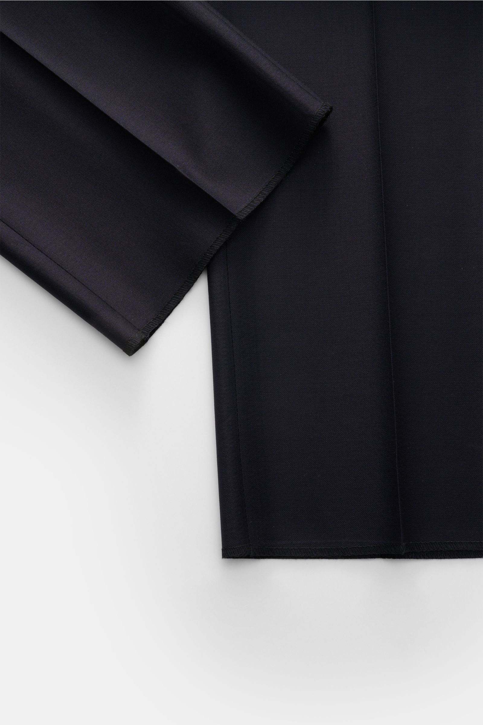 Close-up front view of navy fabric details of the Tagliatore Tuxedo navy, showcasing pure Super 110'S virgin wool with a smooth feel and slim fit.