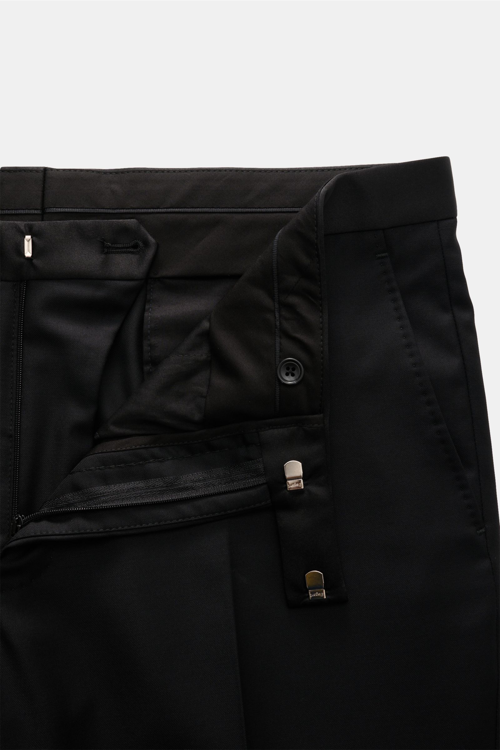 Tagliatore Tuxedo black trousers close-up from front showing waistband, zipper, hook fastener, and button details in pure Super 110'S wool.