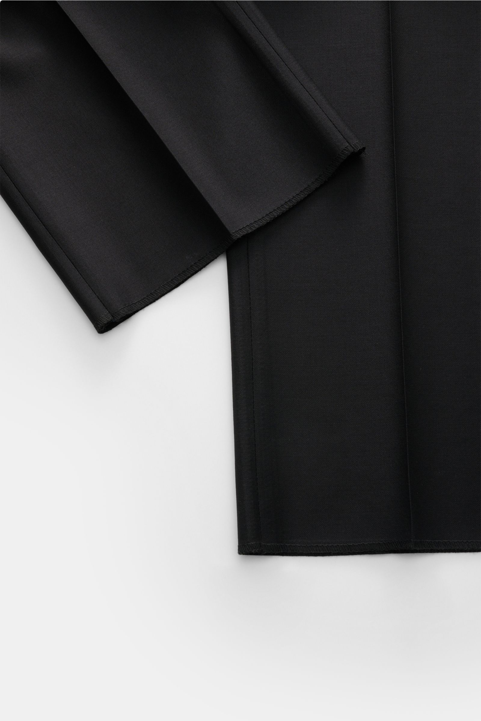 Close-up front view of Tagliatore Tuxedo black trousers in pure Super 110’S virgin wool, showing smooth fabric and slim fit details.
