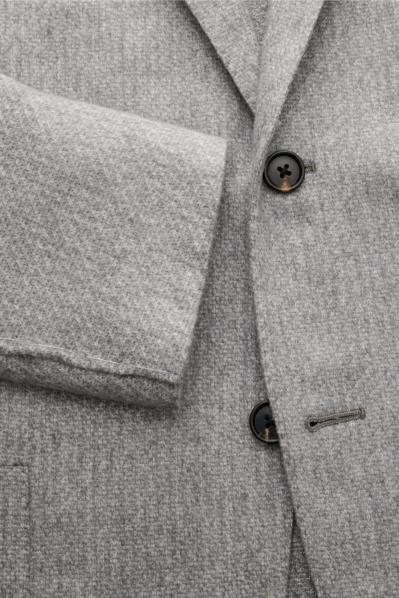 Close-up front view of Corneliani Smart-casual jacket grey mottled, showing soft silk-cashmere fabric and two-button style.

Description:  
The familiar standard of elegance from traditional label CORNELIANI: This timeless, half-lined smart-casual jack
