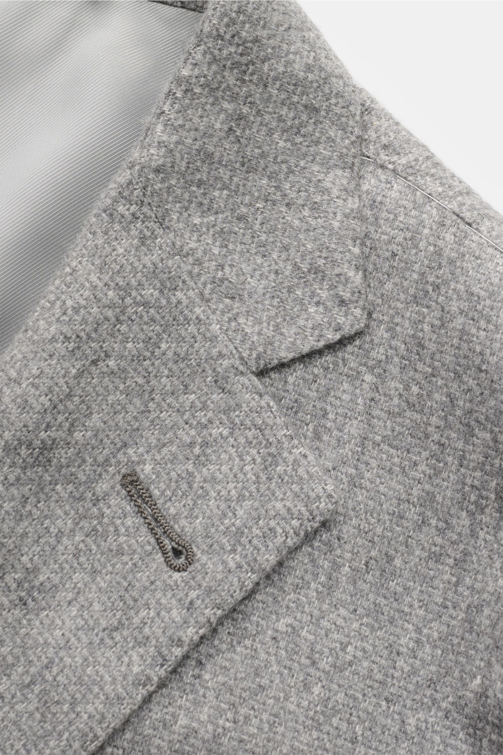 Close-up top-front view of Corneliani Smart-casual jacket grey mottled showcasing a slim-fit, two-button style with step lapel and soft silk-cashmere blend fabric.

Description: The familiar standard of elegance from traditional label CORNELIANI: This 