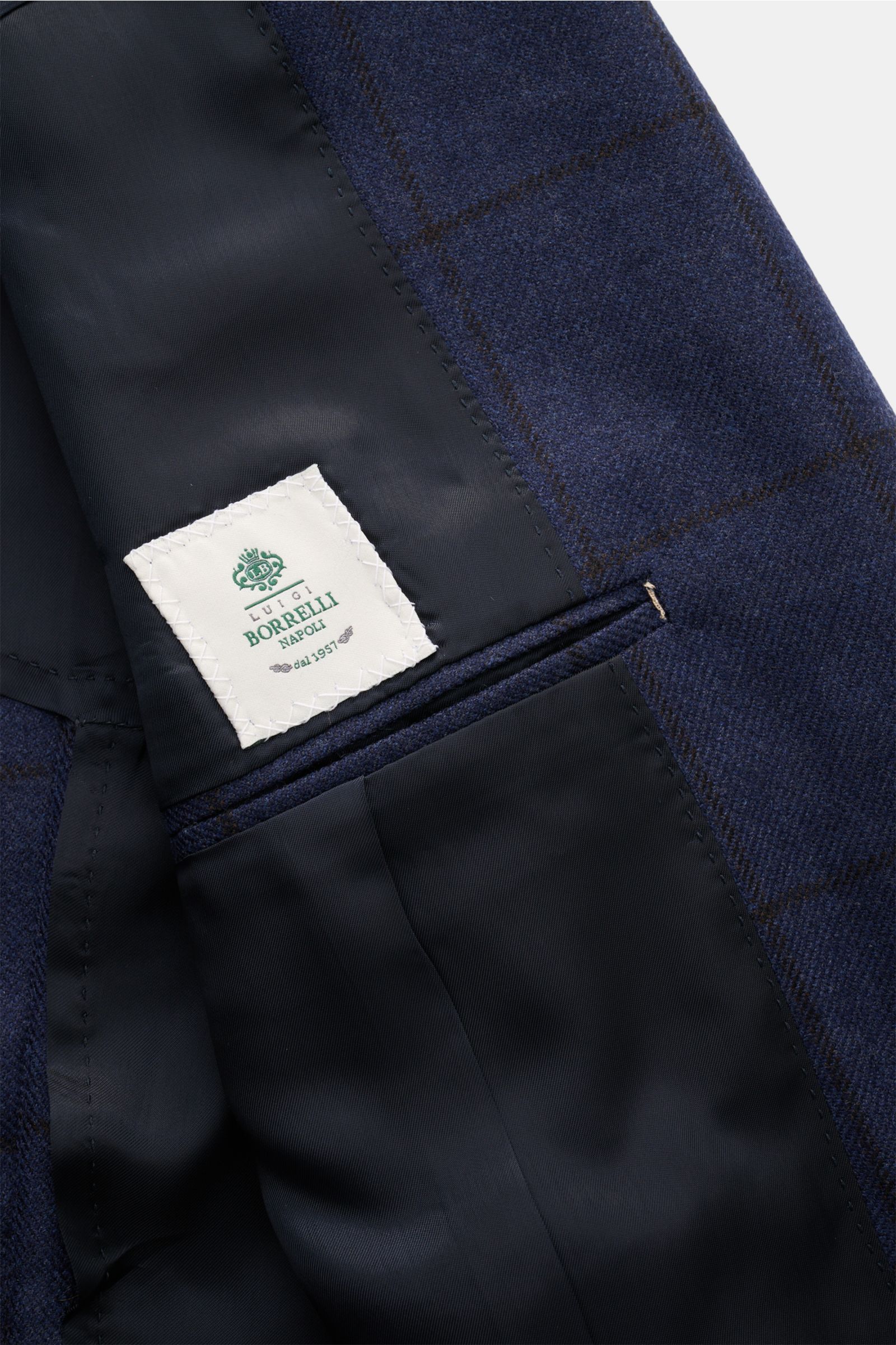 Nahaufnahme des halb gefütterten Innenfutters vom Borrelli Sakko 'Procida' navy/schwarz kariert aus reiner Schurwolle mit weichem Griff.