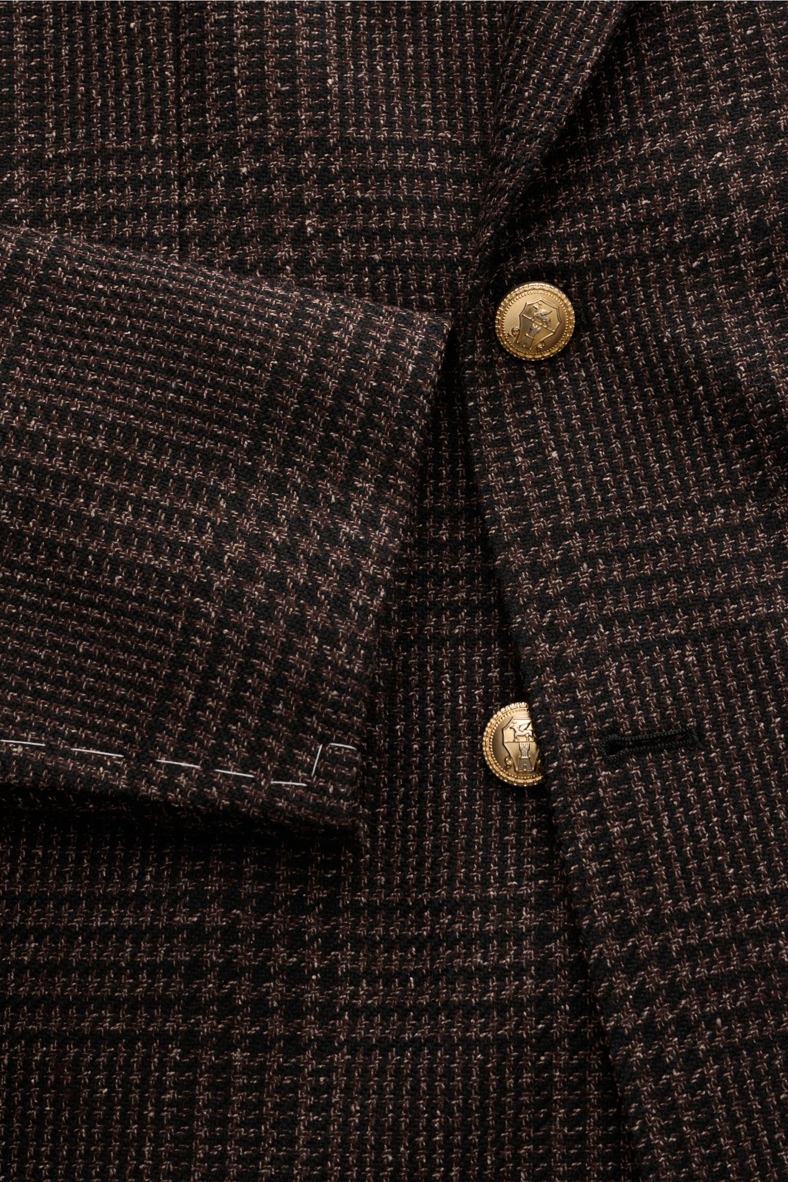 Brunello Cucinelli Sakko schwarz/braun kariert, Slim Fit, tonaler Glencheck, goldfarbene Knöpfe, Spitzrevers, weicher Griff, Ärmelabschlüsse unfertig, Detailfoto von oben.