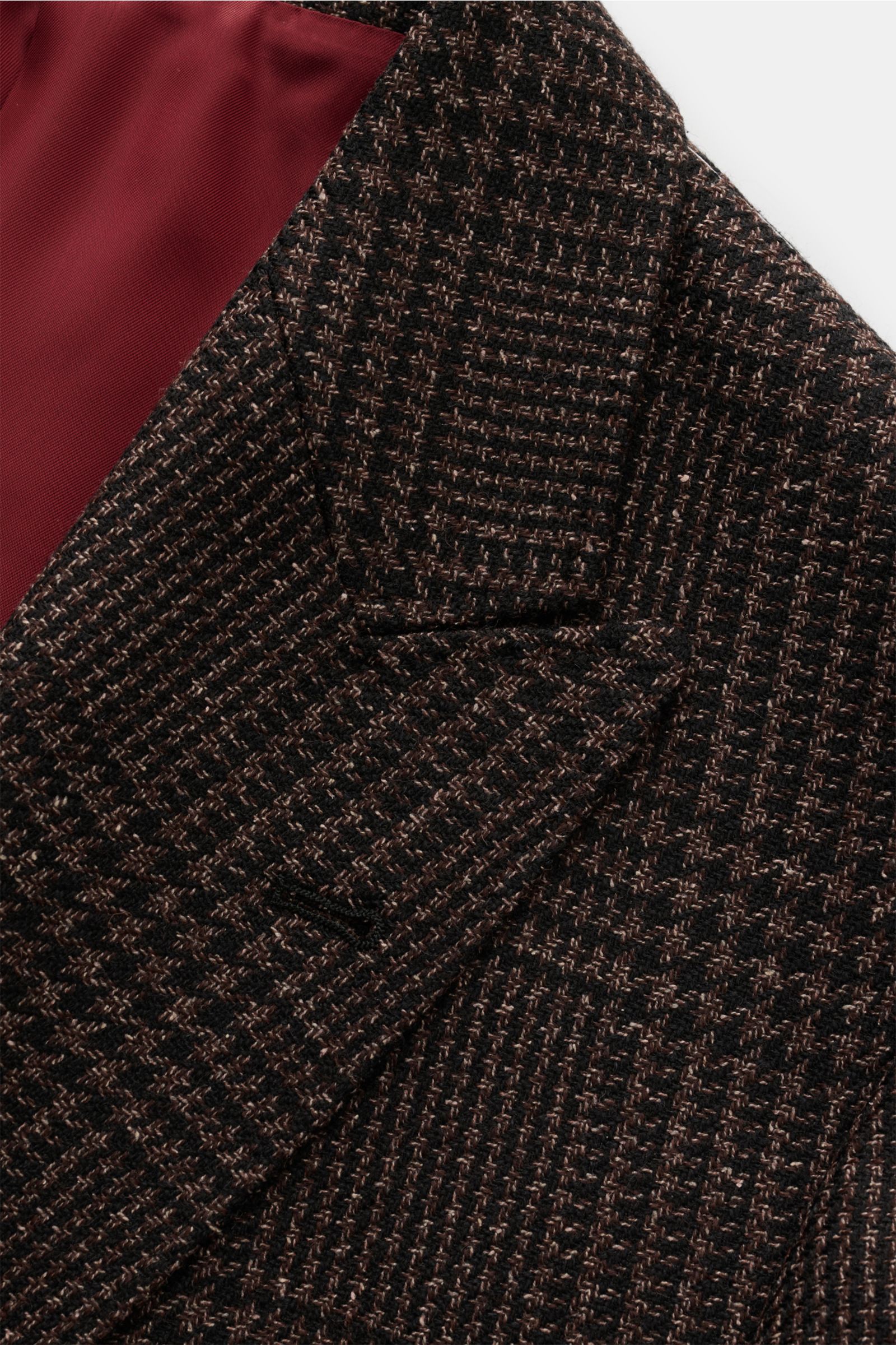 Brunello Cucinelli Sakko schwarz/braun kariert, Slim Fit, tonaler Glencheck, Mix aus Wolle, Alpaka, Seide, Spitzrevers, goldfarbene Logo-Knöpfe, halb gefüttert, Detailfoto von oben.
