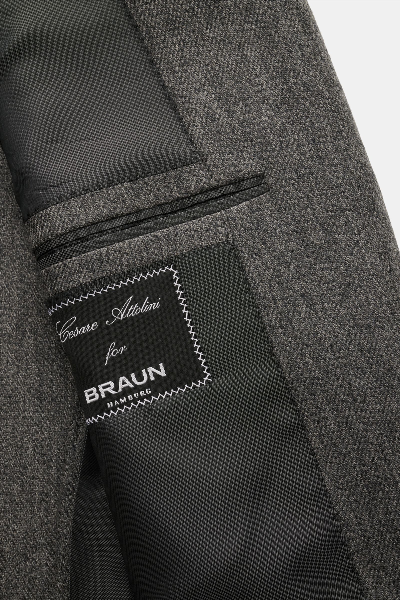 Close-up inside view of the Cesare Attolini Cashmere jacket grey mottled showing the black lining, label, and inner pocket details.

Enjoy luxury from CESARE ATTOLINI: This timeless smart-casual jacket is made in Italy from the finest pure cashmere – a