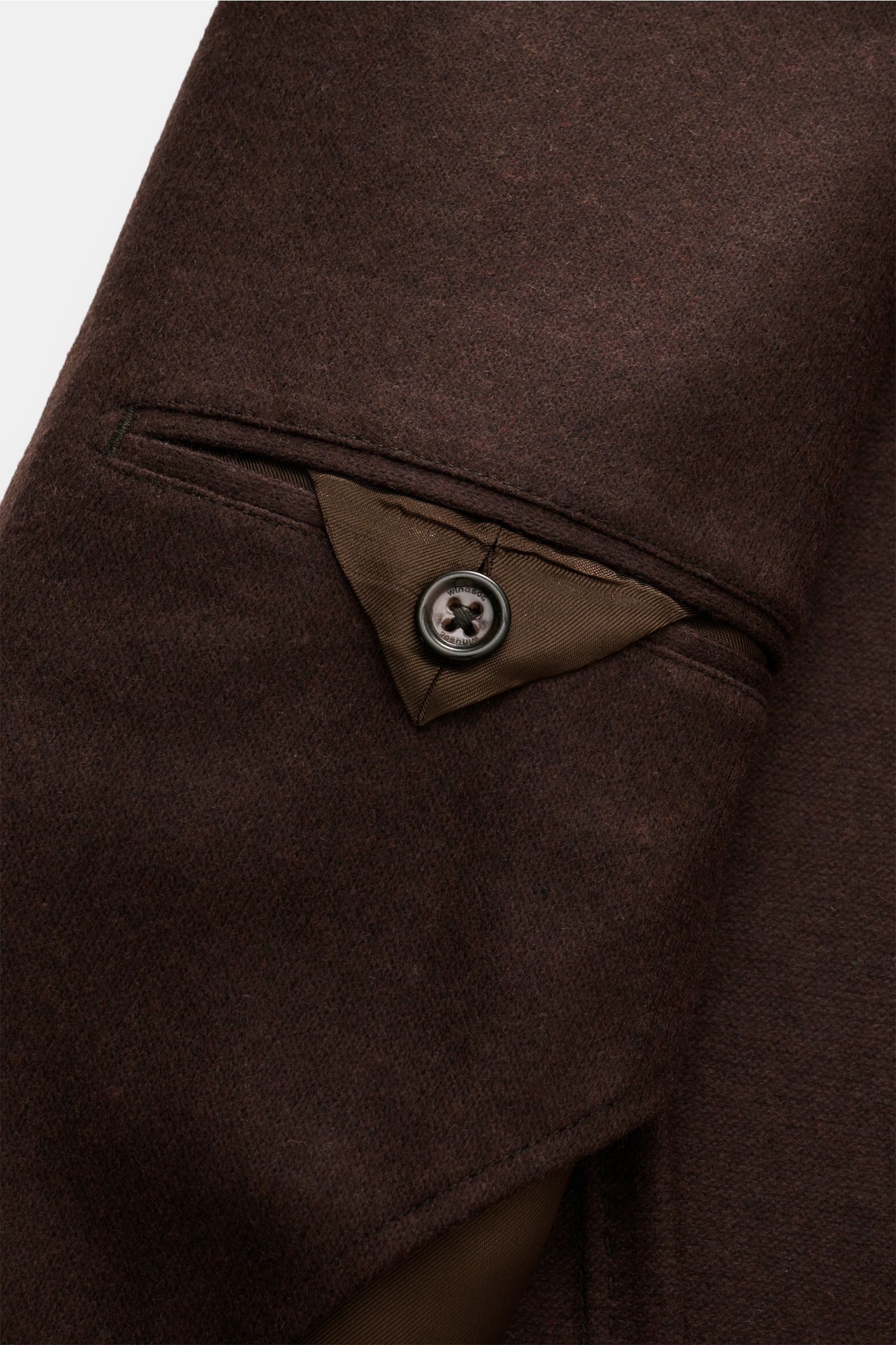 Close-up of the Windsor Cashmere jacket 'Giro' dark brown showing the patch hip pocket with button detail, photographed from a side angle. Stylish business essential: This cashmere smart-casual jacket by WINDSOR is a versatile piece for sophisticated offi