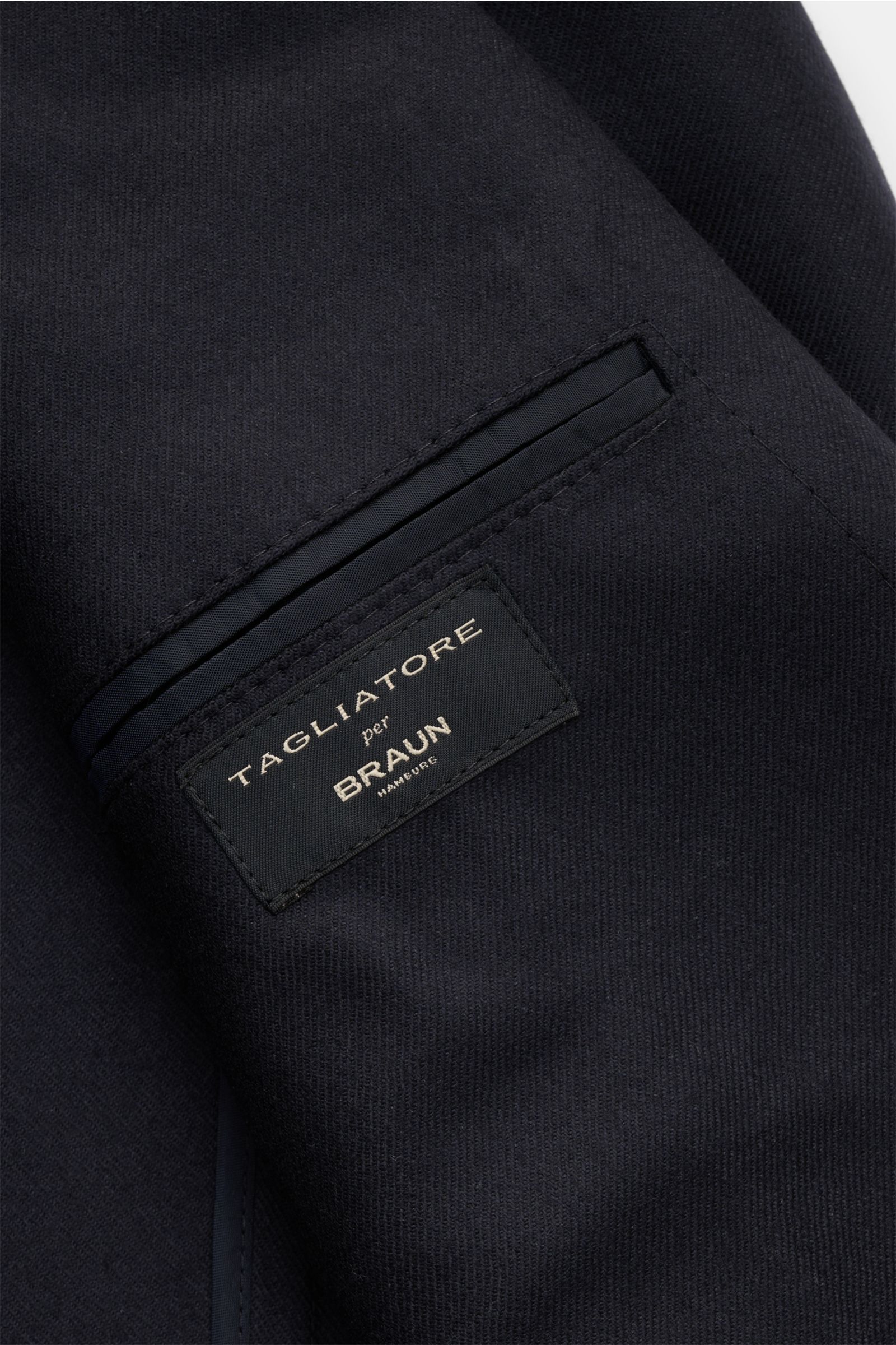 Close-up view of the inside label on the Tagliatore Sakko 'Monte Carlo' dark navy, made from elastic wool-cashmere twill with a soft, slim-fit, unconstructed design ideal for office and evening wear.