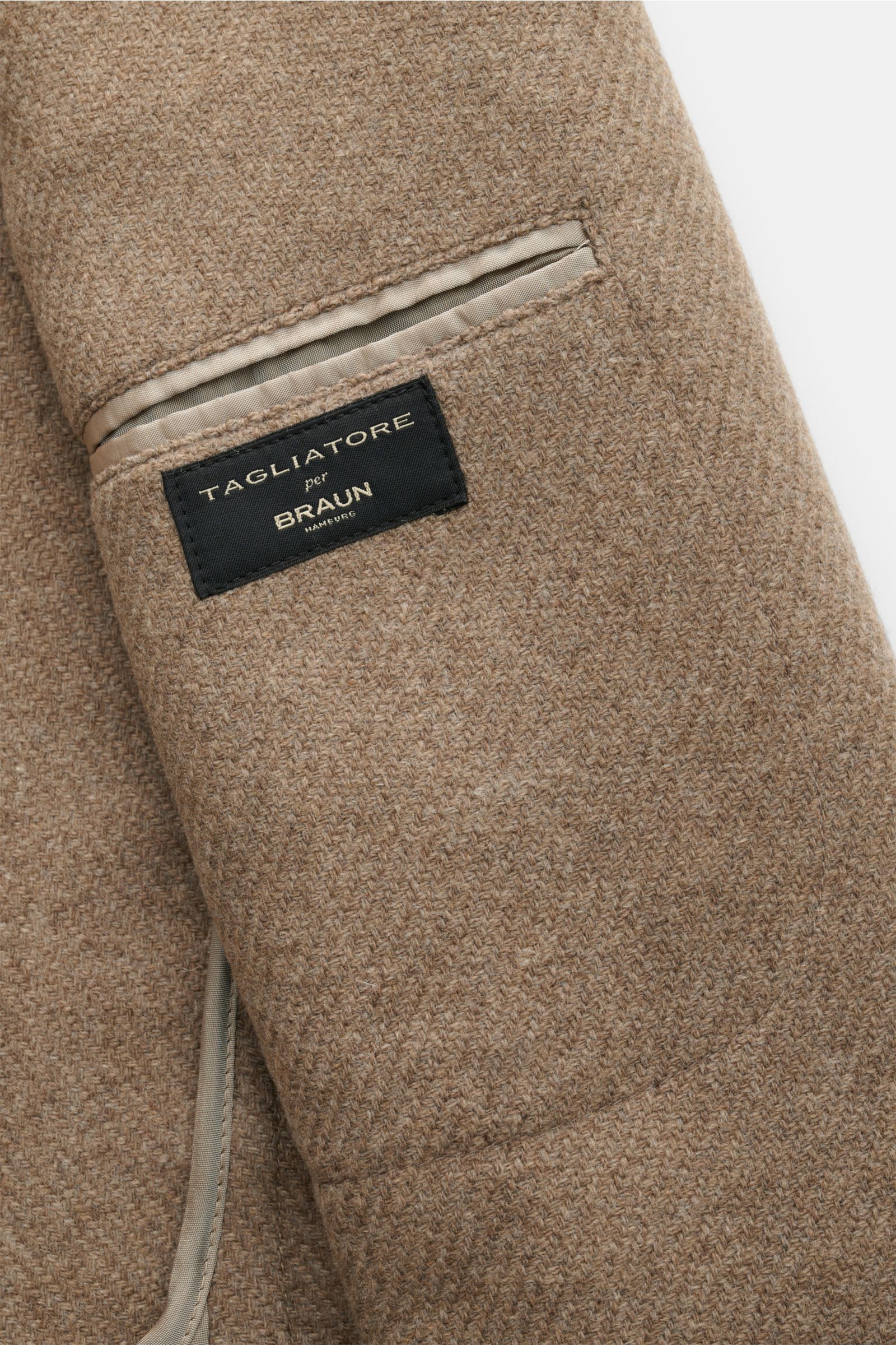 Detailaufnahme innen links eines beigen Tagliatore Sakko 'Monte Carlo' mit Unconstructed Design, Wollmix und Innentasche.