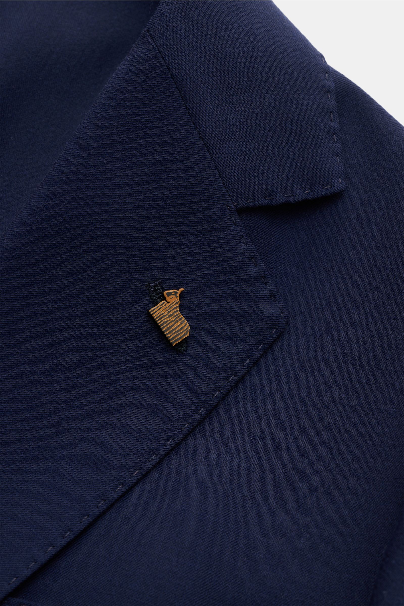 Close-up front-left view of the Colombo Cashmere blazer navy lapel with a small pin, showcasing pure cashmere, soft feel, very lightweight fabric, slim fit, two-button style, step lapel with pin, classic breast pocket, patch hip pockets, unfinished sleeve