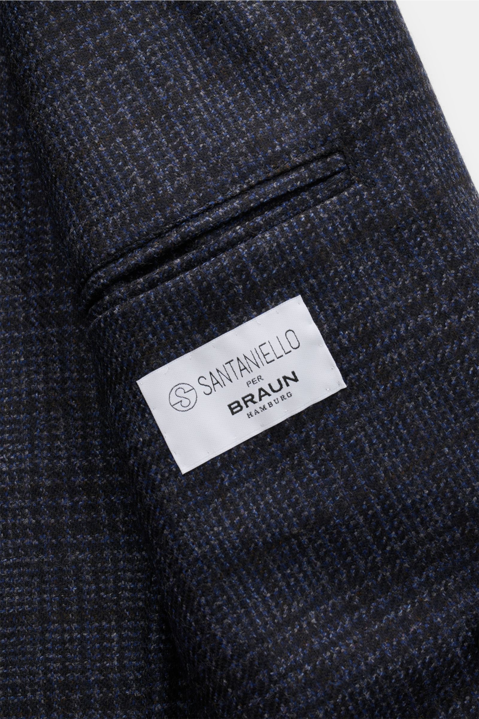 Close-up inside view of the Santaniello Smart-casual jacket dark blue/grey/black checked showing the label and fine glen check wool fabric texture. Classic elegance for the new season: This double-breasted smart-casual jacket by SANTANIELLO in fine wool w