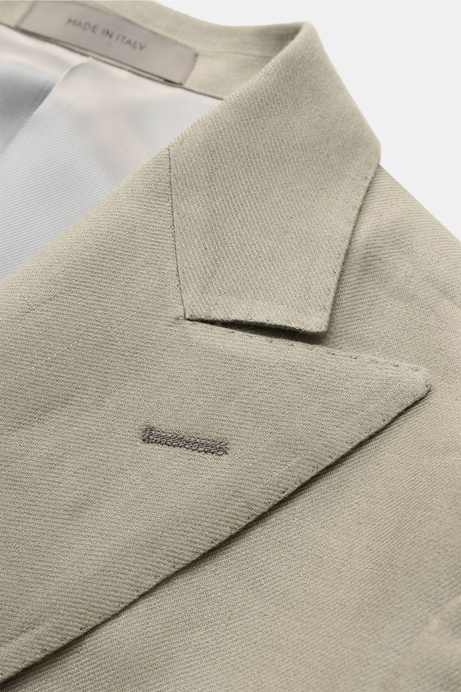 Corneliani Leinensakko salbei in Nahaufnahme von oben, zweireihig, weiches reines Leinen mit feiner Webstruktur, Slim Fit, italienische Meisterhand.