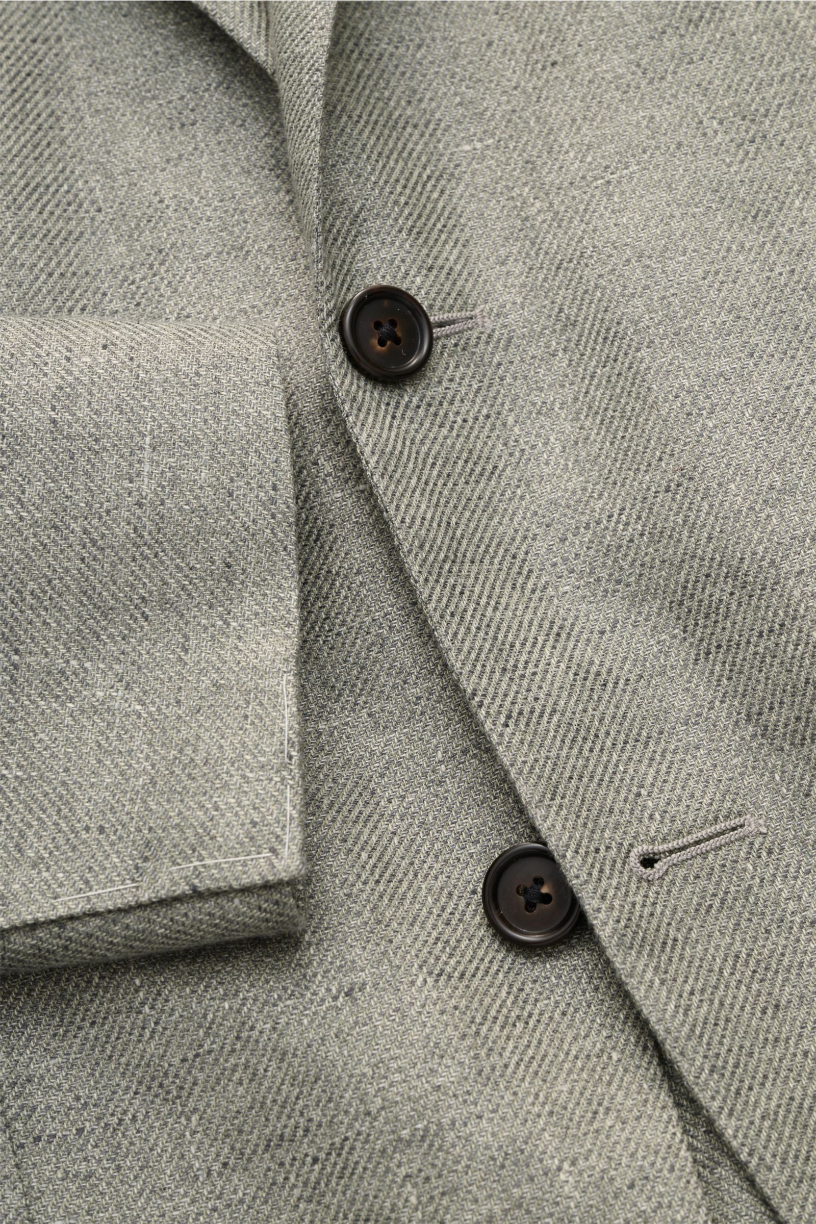 Close-up front view of Corneliani Smart-casual jacket sage mottled in lyocell and linen with dark buttons and step lapel.

Description: 
Superlative style from CORNELIANI: in a optimal fit made with Italian expertise, this smart-casual jacket in lightw