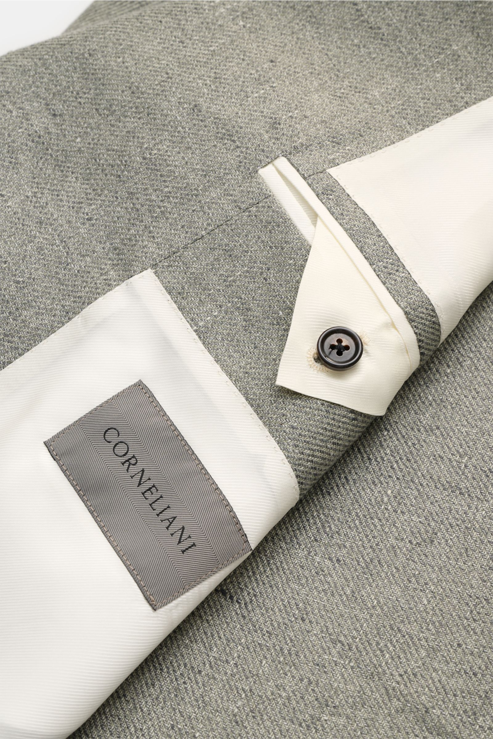 Close-up of the inside and sleeve cuff of the Corneliani Smart-casual jacket sage mottled, showing fabric texture and label.

Superlative style from CORNELIANI: in a optimal fit made with Italian expertise, this smart-casual jacket in lightweight lyoce