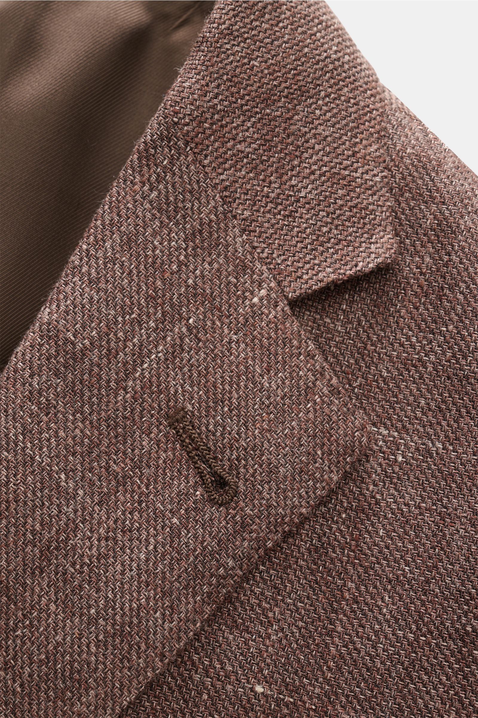 Close-up front side view of Corneliani Smart-casual jacket brown melange showing fine virgin wool and linen weave with step lapel.

Description: Superlative style from CORNELIANI: in a optimal fit made with Italian expertise, this smart-casual jacket i