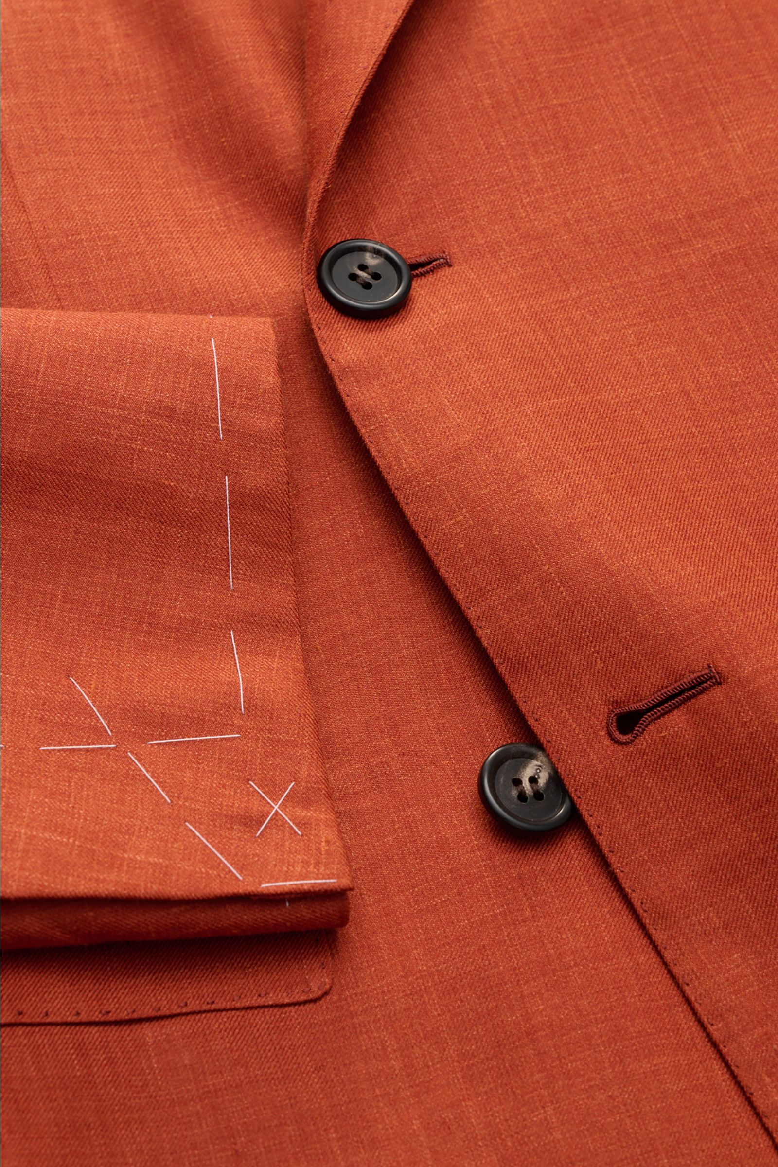 Close-up front view of Brioni Smart-casual jacket 'New Plume' red brown mottled showing buttons and sleeve with white stitching.

Description: Made of a sophisticated blend of silk and cashmere, the smart-casual jacket 'New Plume' by BRIONI combines th