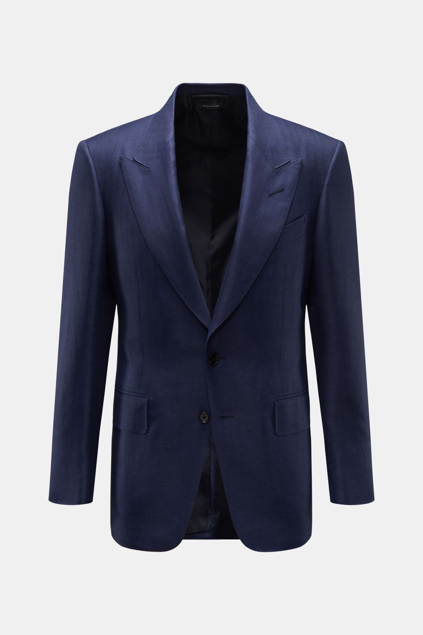 Front view of Tom Ford Sakko 'Shelton' navy, a slim fit, two-button jacket in a wool, silk, and linen mix with subtle herringbone pattern, soft touch, peak lapels, classic chest pocket, flap hip pockets, back side vents, unfinished sleeve cuffs, and four 