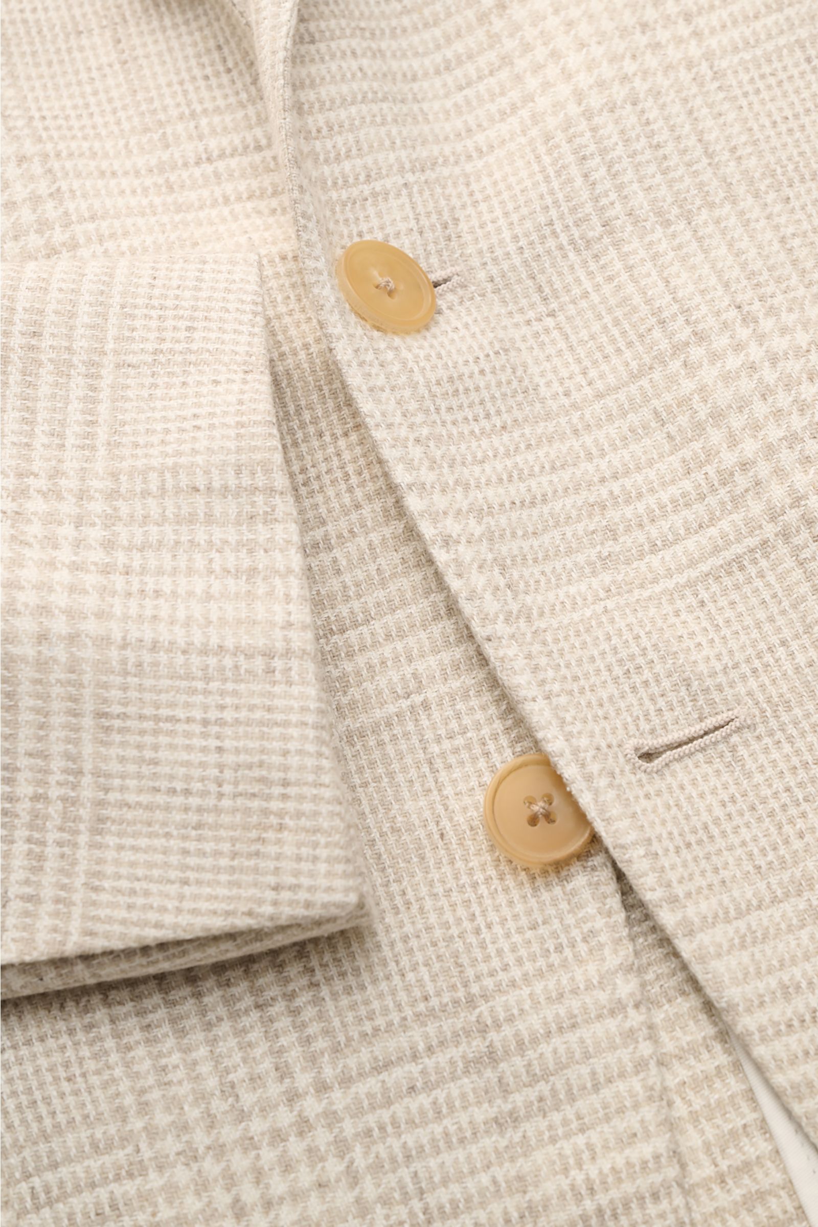 Close-up front view of the Belvest Smart-casual jacket cream/beige checked showing fabric texture, buttons, and subtle glen check pattern.

BELVEST has brought together the best in natural materials – wool, linen, silk and cashmere – in this summery sm