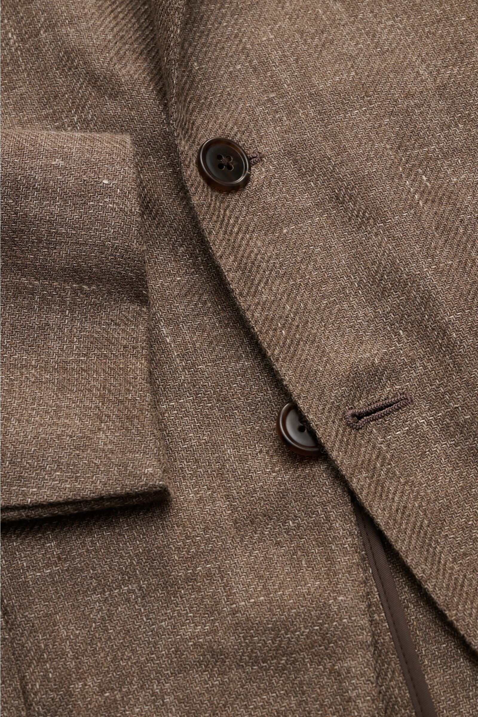 Close-up front view of Belvest Smart-casual jacket grey-brown melange showing linen-wool blend fabric, buttons, and textured slim fit design. 

Linen and wool form the basis for this unconstructed smart-casual jacket from label BELVEST which can be wor