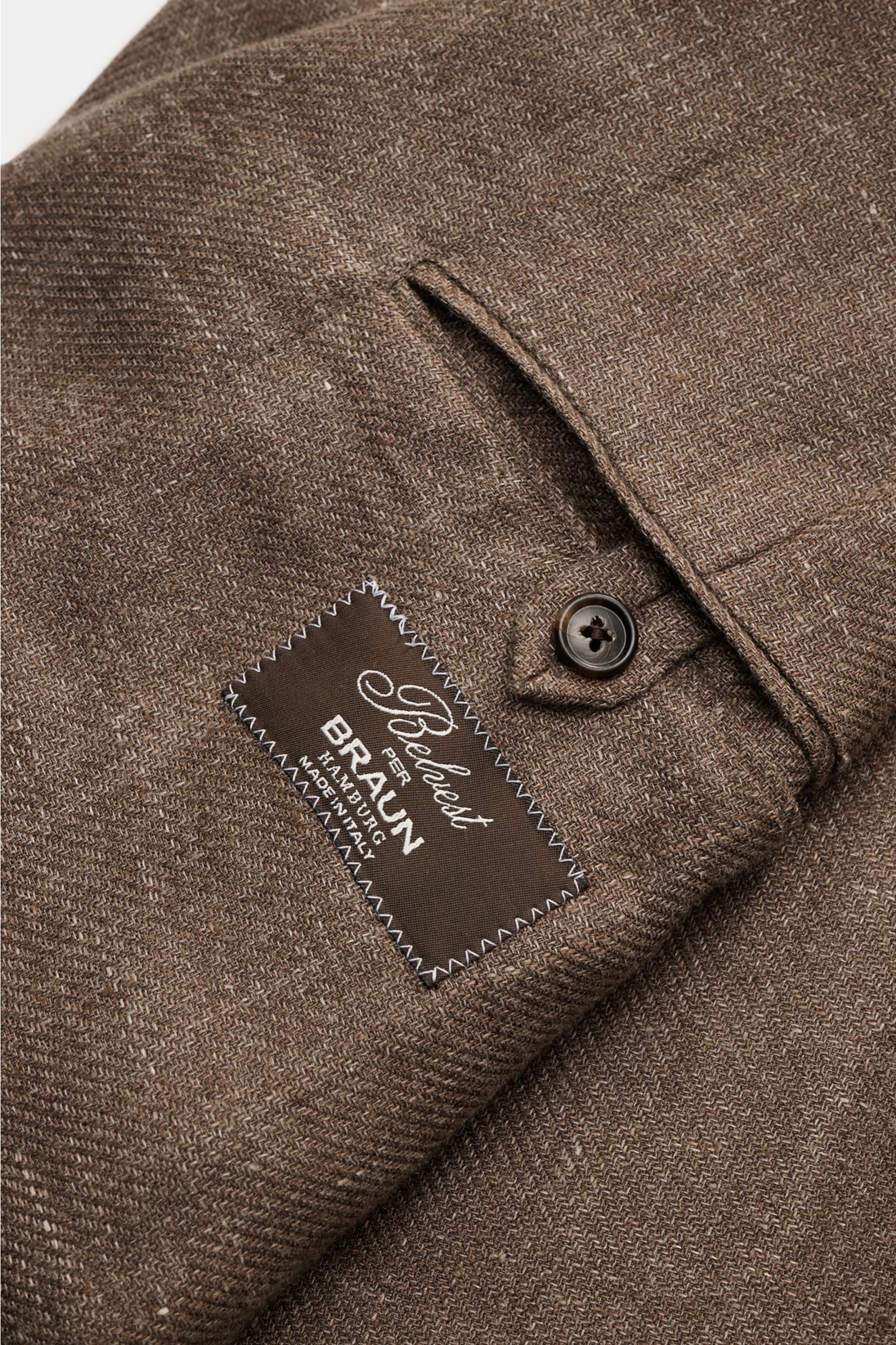Close-up view of the sleeve cuff and label of the Belvest Smart-casual jacket grey-brown melange showing fabric texture and button detail.

Linen and wool form the basis for this unconstructed smart-casual jacket from label BELVEST which can be worn as
