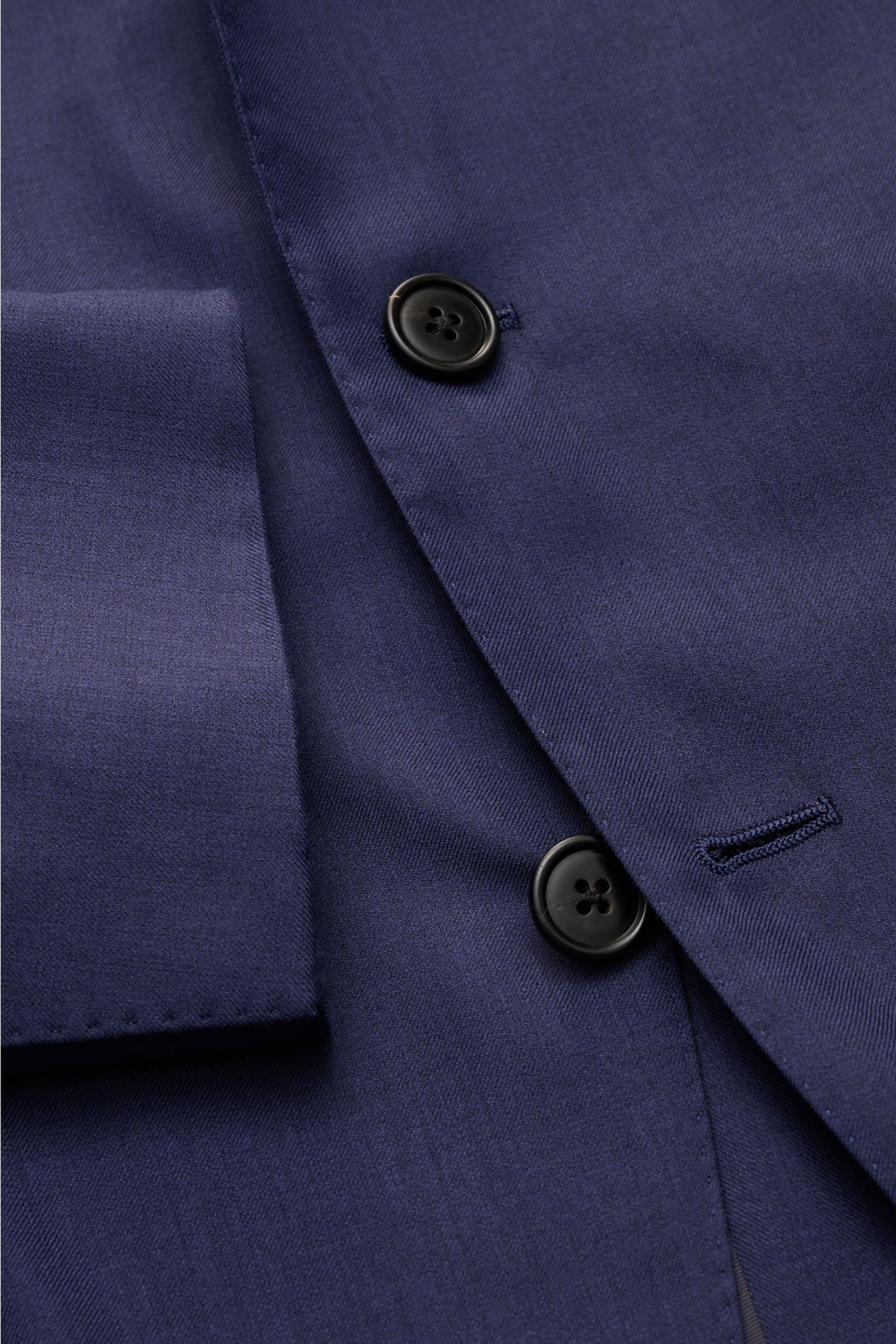 Close-up front view of Belvest Smart-casual jacket navy showing fitted three-button style, wool-silk blend fine twill fabric, step lapel with pin, and unfinished sleeve cuff.