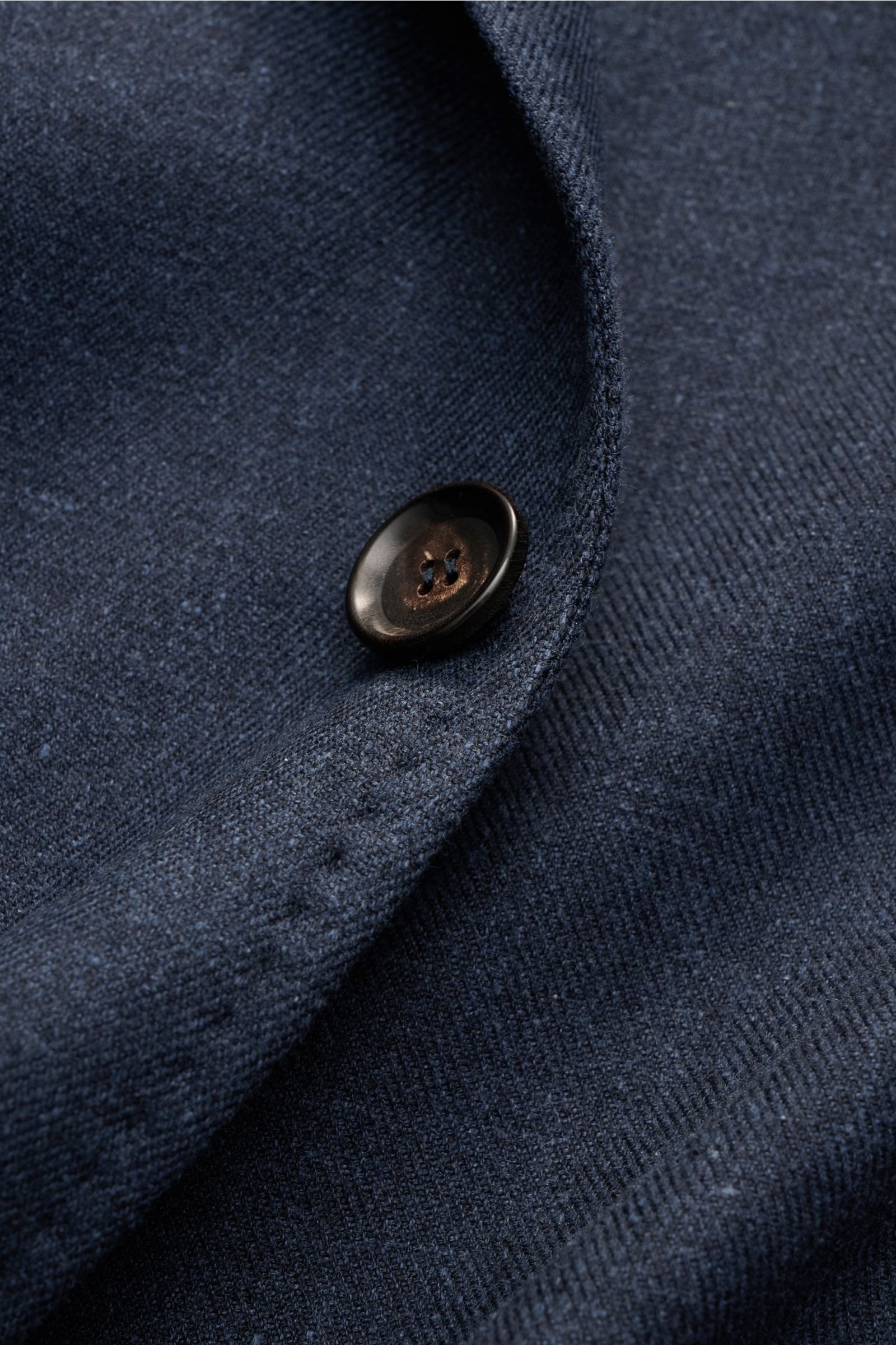 Close-up front detail of the Stile Latino Smart-casual jacket 'Vincenzo' navy mottled showing the fabric texture and button.

Description: STILE LATINO presents luxury you can feel with its elegant smart-casual jacket 'Vincenzo' in a blend of lightweig