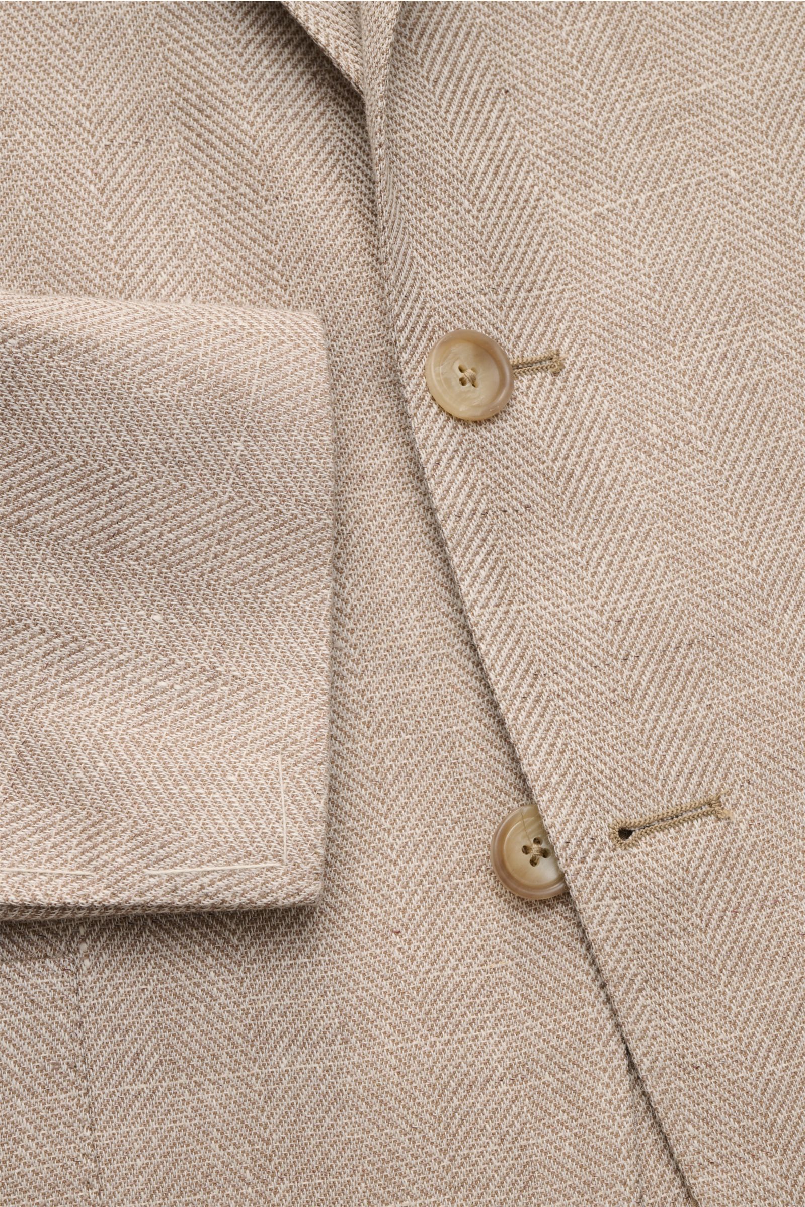 Tagliatore Smart-casual jacket 'Monte Carlo' beige mottled close-up from above, showing herringbone fabric, buttons, and sleeve cuff details.