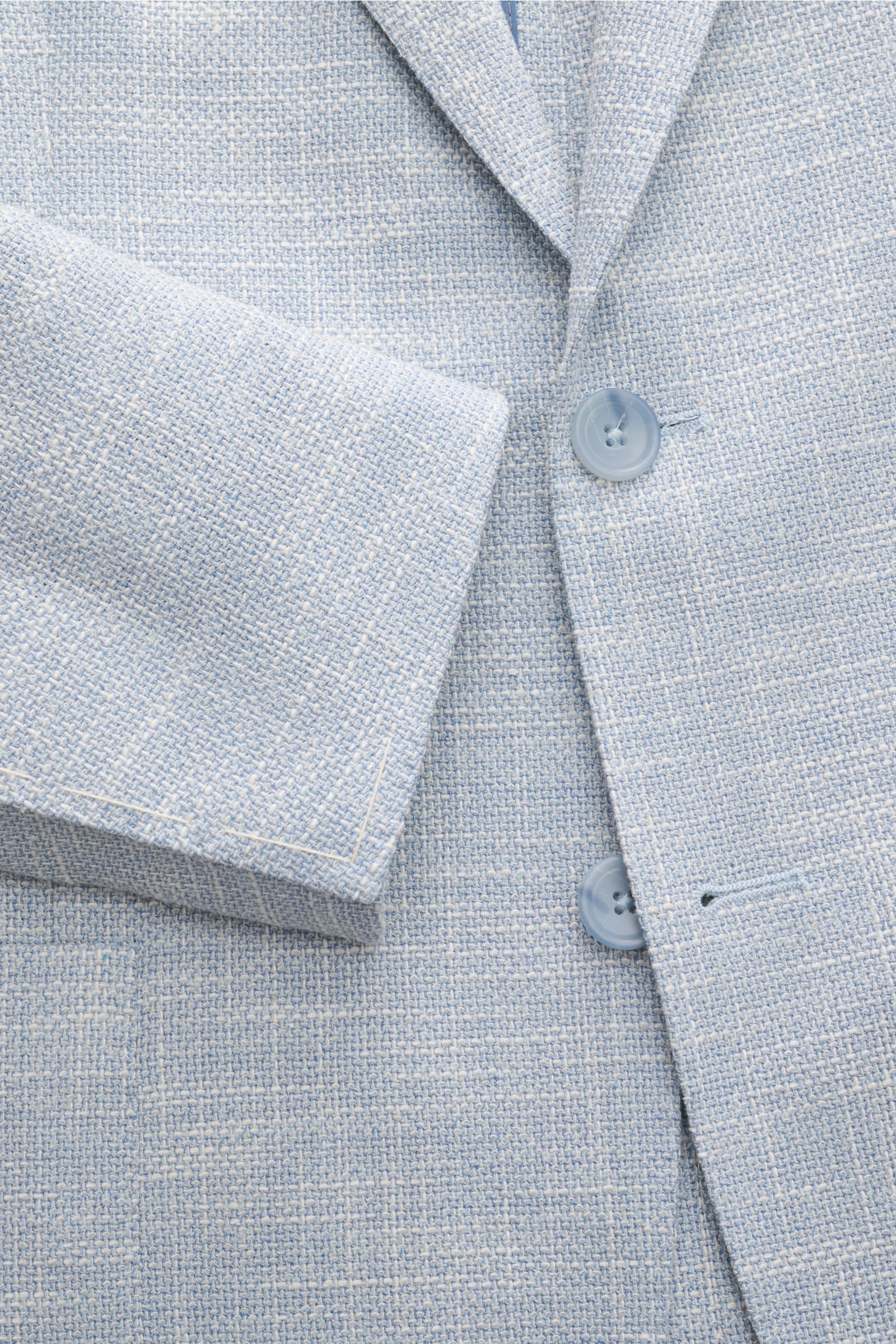 Nahaufnahme des Tagliatore Sakkos 'Monte Carlo' rauchblau/weiß meliert mit Unconstructed-Verarbeitung, Slim Fit, zwei Knöpfen, fallendem Revers und weichem Strukturgewebe.