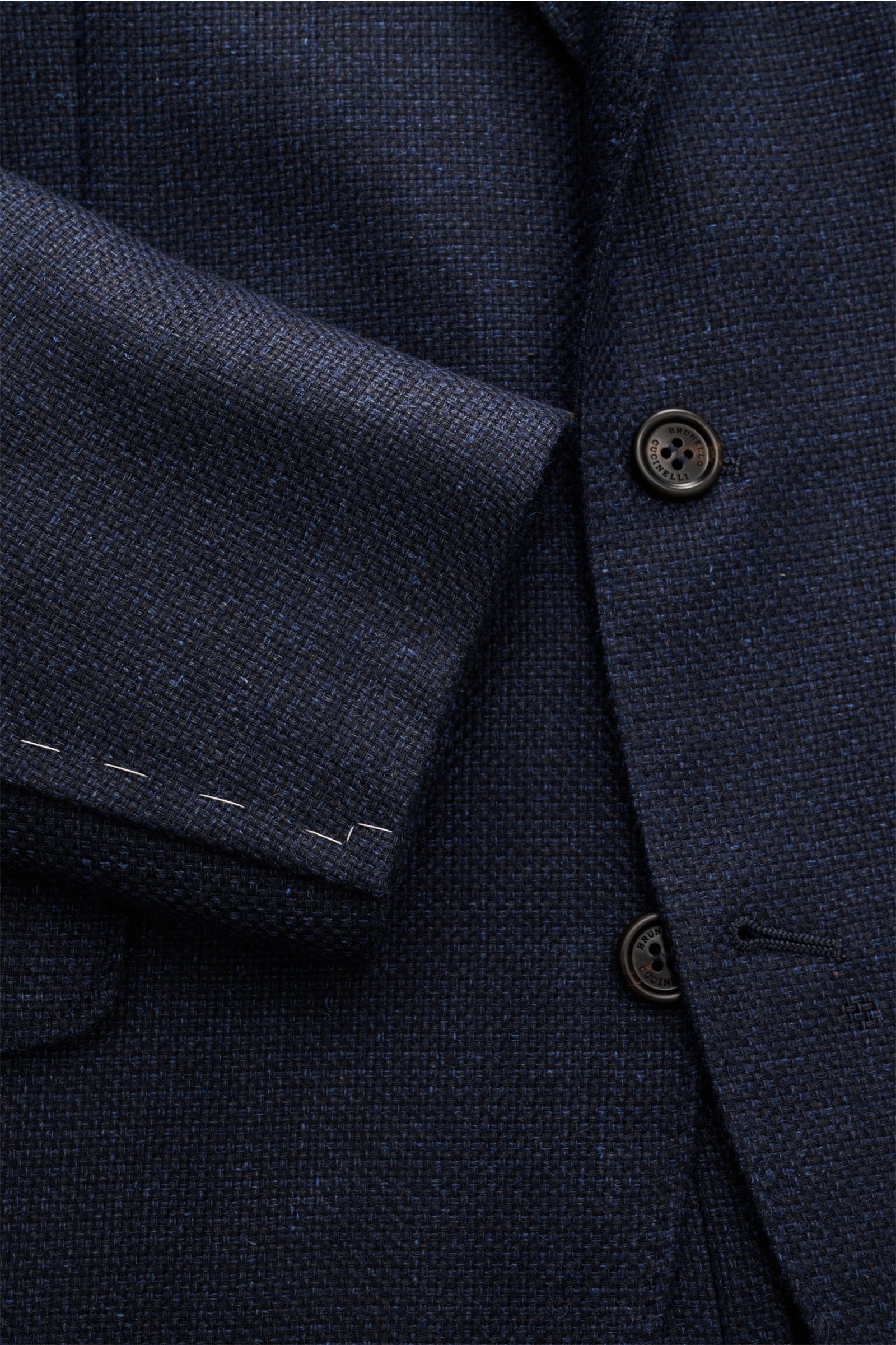 Close-up view of the Brunello Cucinelli Sakko navy meliert fabric and buttons, showing the melierte three-button slim fit jacket with a mix of silk, linen, and wool, soft grainy texture, and distinct woven structure.