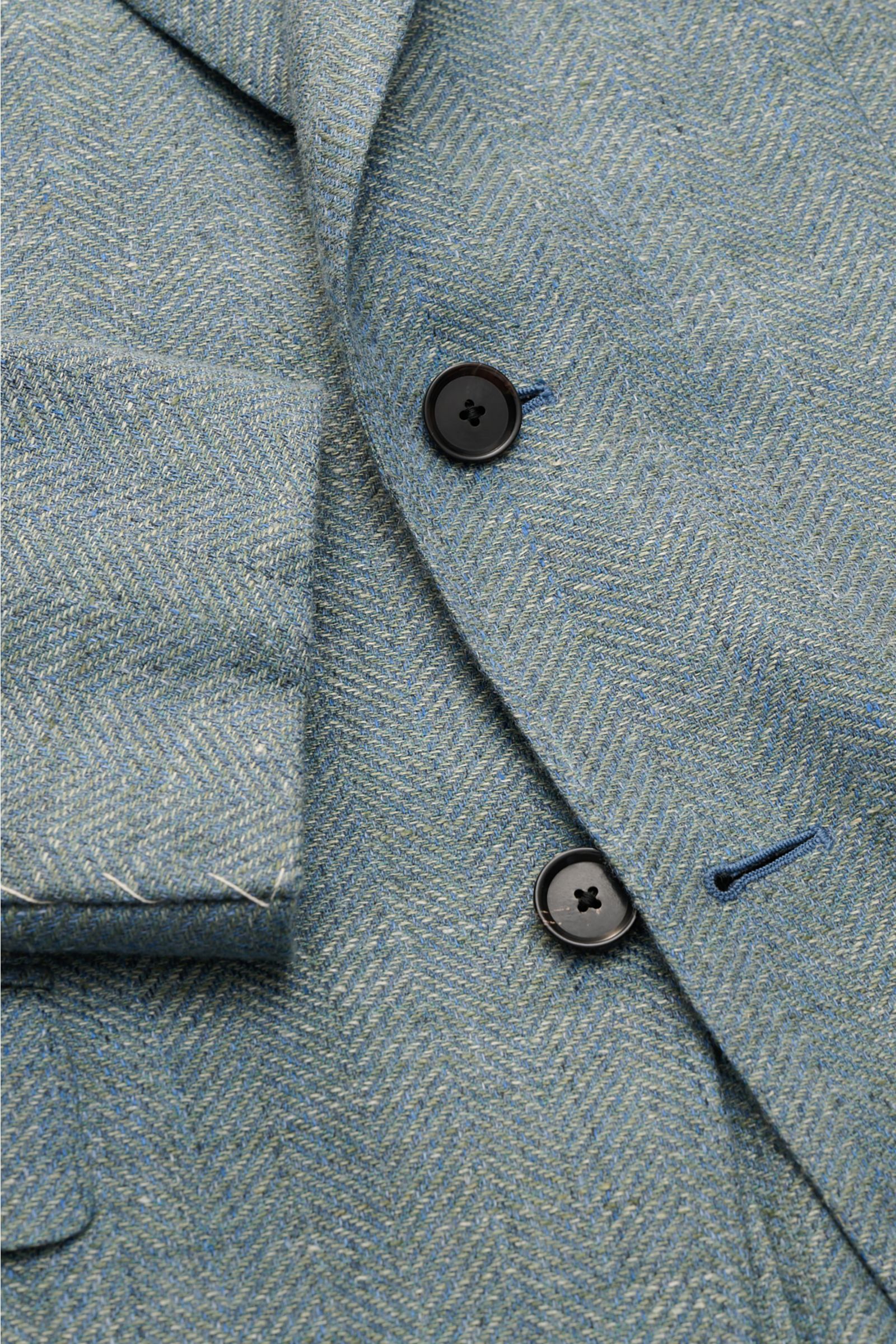 Close-up front view of Caruso Smart-casual jacket 'Aida' grey-green mottled showing herringbone texture, buttons, and unfinished cuffs.

In the smart-casual jacket 'Aida', CARUSO combines smart style with fabric in the natural materials linen and wool 
