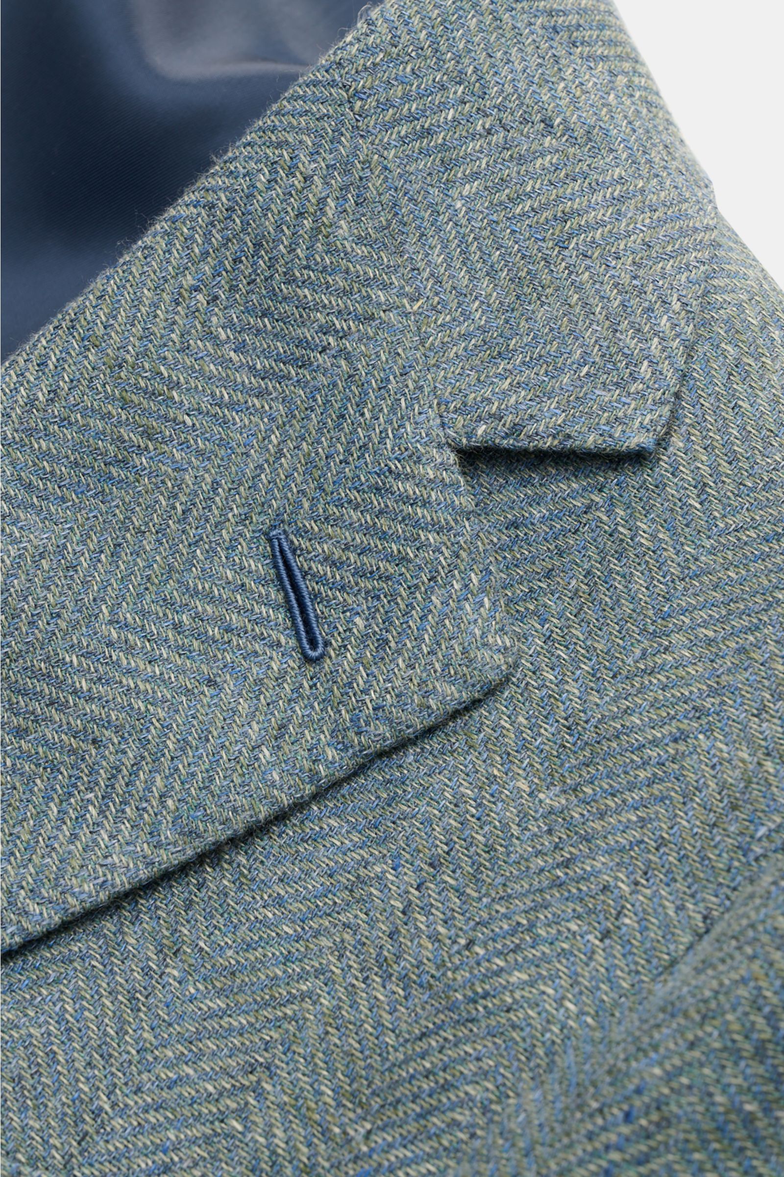 Close-up front angle of Caruso Smart-casual jacket 'Aida' grey-green mottled with linen and wool blend, slim fit, herringbone texture, step lapel, and classic breast pocket.