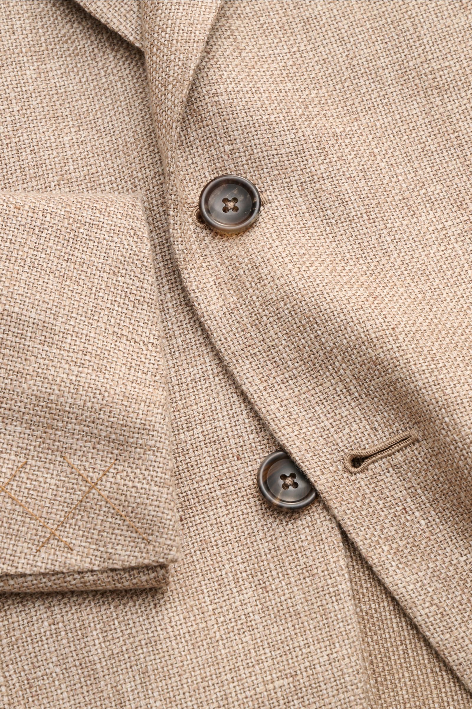 Close-up front view of Zegna Smart-casual jacket taupe mottled showing buttons, step lapel, and patch hip pocket in linen-wool-silk blend.

Hot days are guaranteed to be enjoyable in this smart-casual jacket in linen, wool and silk with distinctive mot