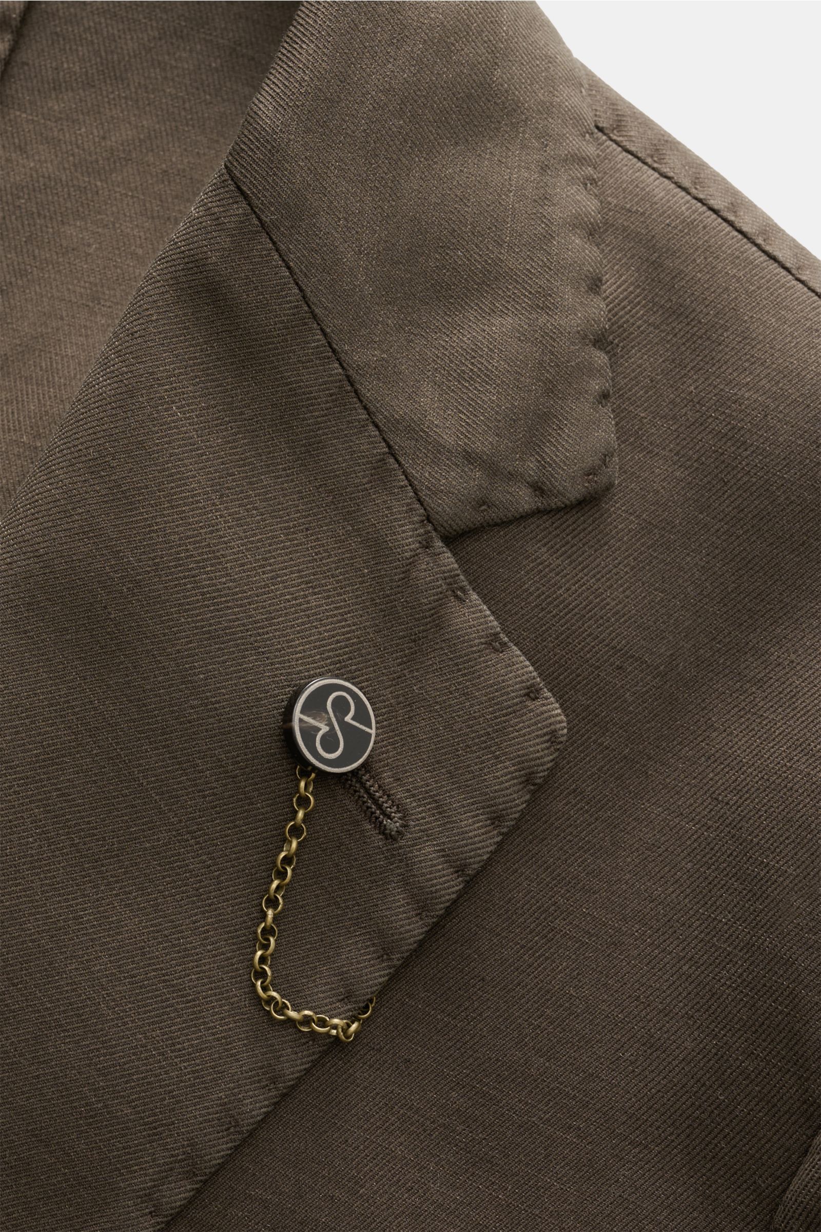 Close-up front angle of the Santaniello Smart-casual jacket dark brown showing step lapel with label pin and button detail, made from a cotton, linen, and mohair blend with a soft feel, slim fit, fitted two-button style, classic breast pocket, patch hip p