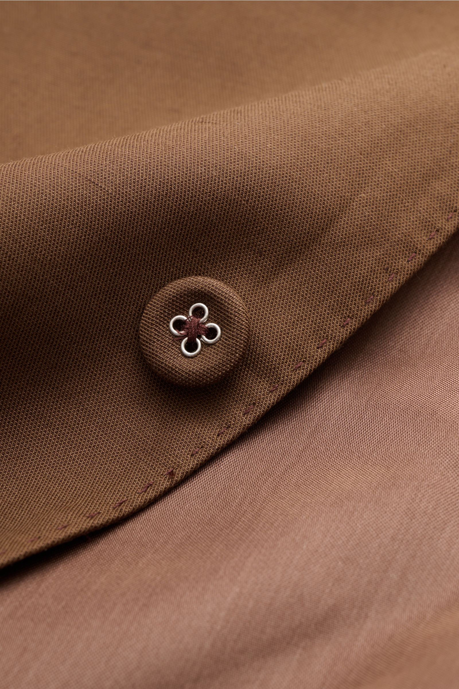 Officine Générale Smart-casual jacket 'Michel' brown shown in close-up from a front angle, highlighting fabric texture and button details, made of lyocell, linen, and cotton blend with smooth feel, lightweight fabric, slim fit, two-button style, step lape
