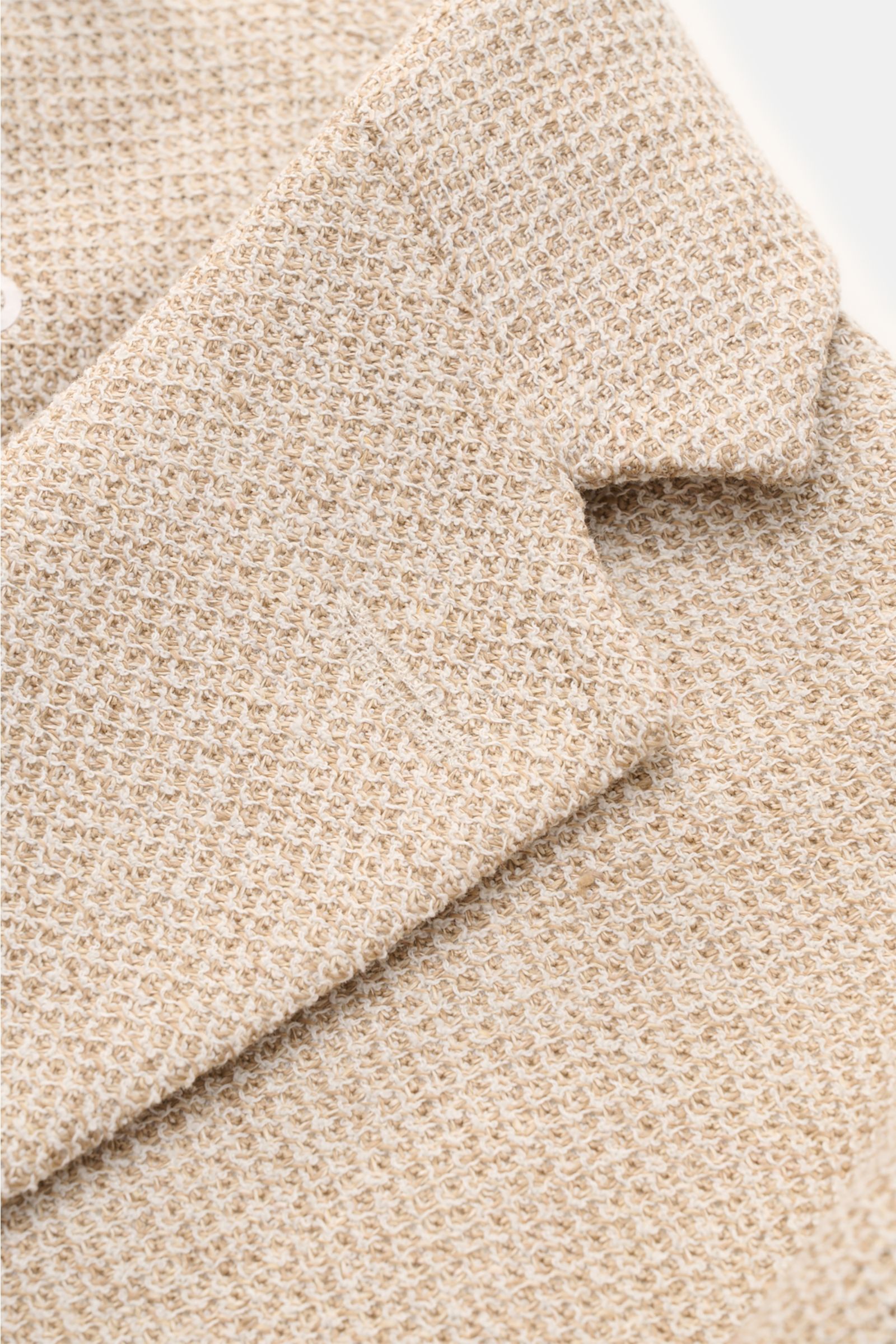 Close-up angled view of Circolo 1901 Smart-casual jacket beige mottled showing textured linen blend fabric and step lapel detail.

This slim fit smart-casual jacket in a linen blend in slightly stretchy fabric by CIRCOLO 1901 features a contemporary un