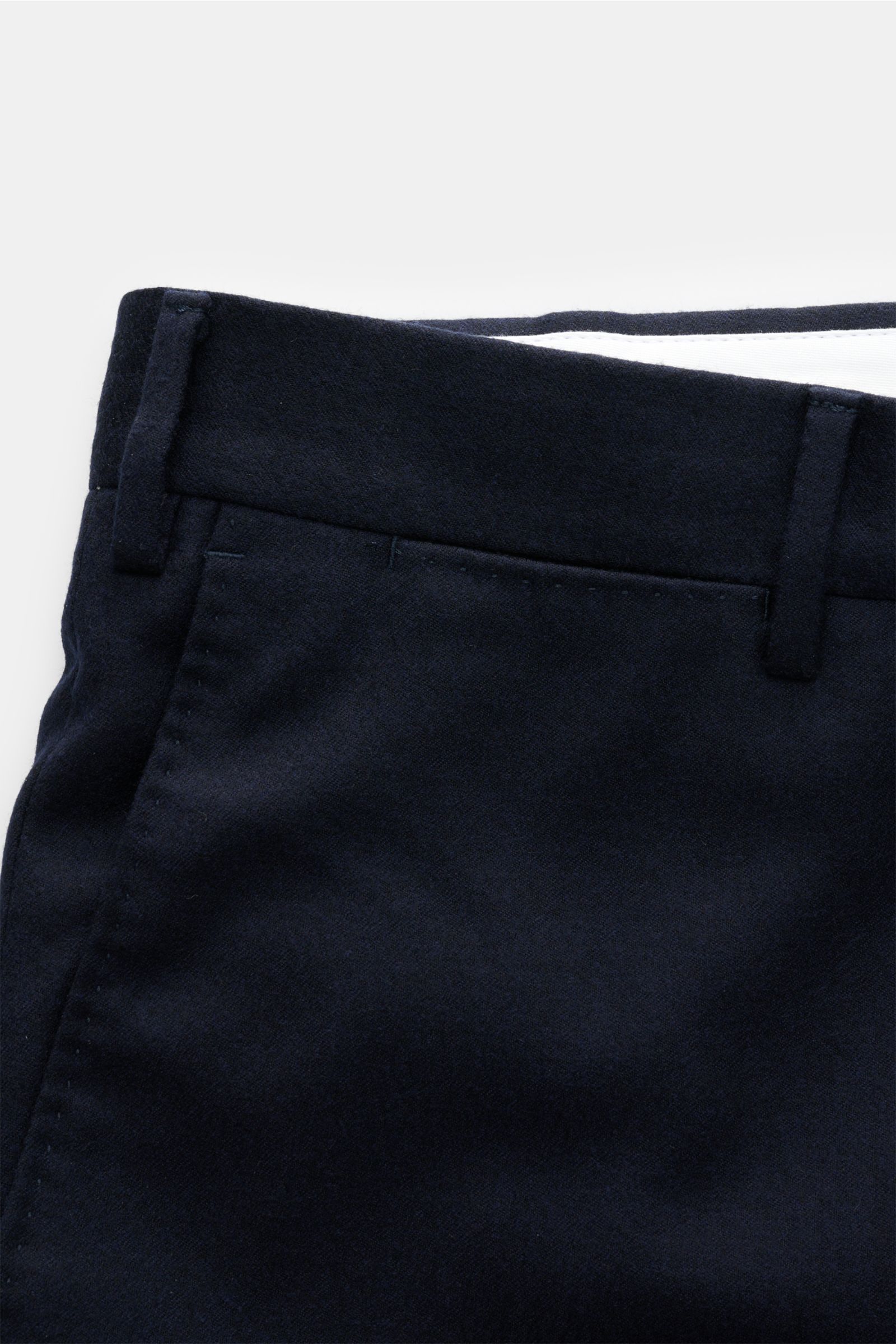 Close-up front view of PT Torino Wool trousers 'Slim Fit' dark navy, showcasing fine wool fleece fabric with slight stretch content, slim tapered cut, belt loops, and neat stitching details. For these exclusive trousers, PT TORINO has chosen fine wool fle