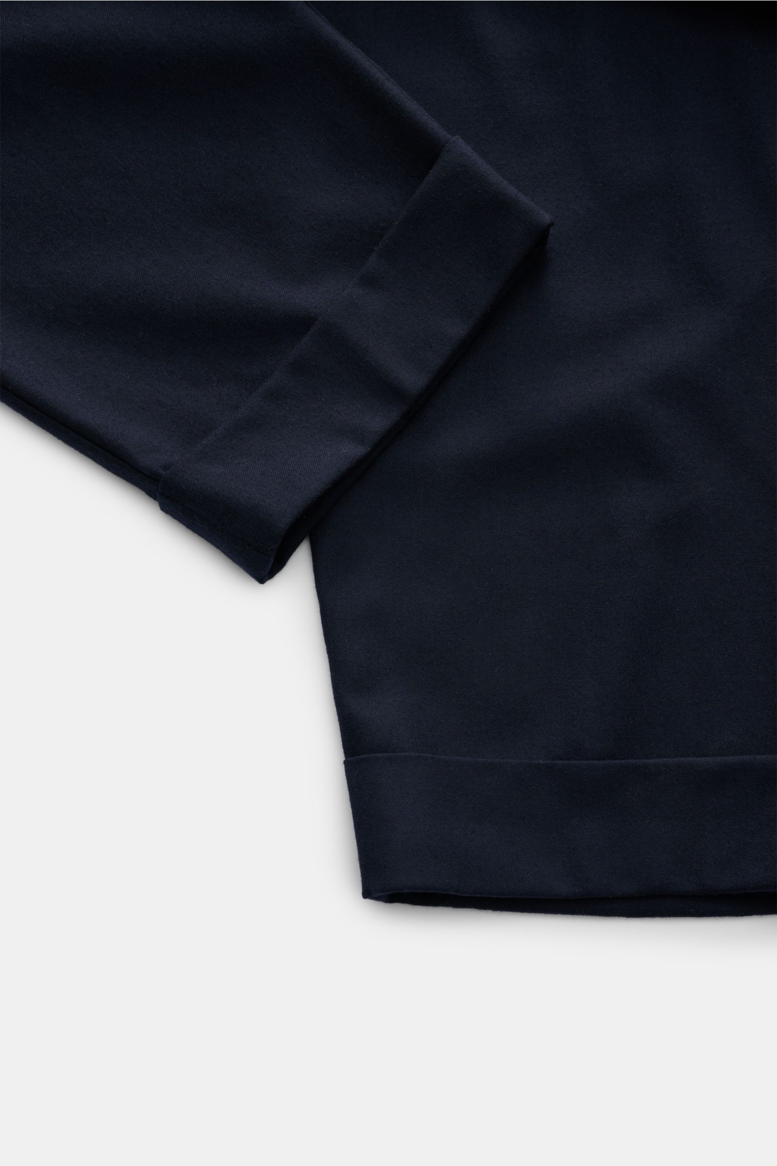 Marco Pescarolo Woll-Jogpants 'Varenne' navy shown from a close-up top-down perspective, featuring pure wool, soft touch, tapered fit, elastic waistband with drawstring, zippered back pockets, and fixed cuff hem. 