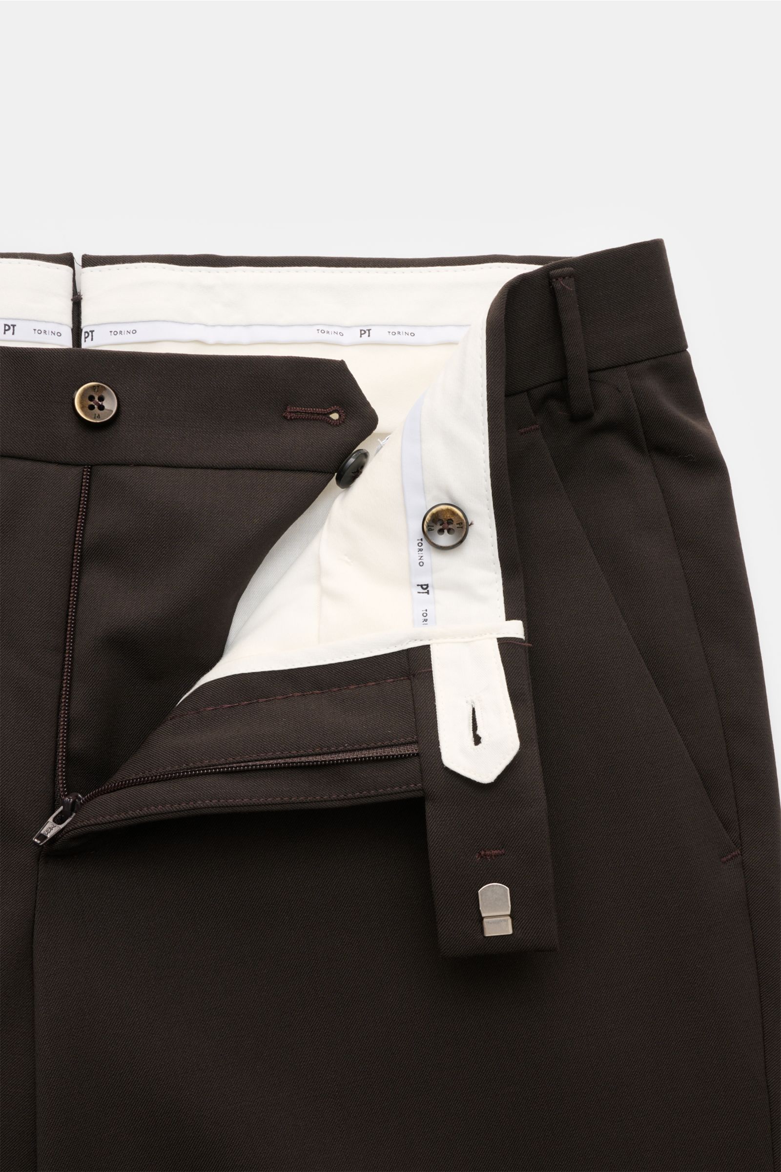 Close-up front view of PT Torino Wool trousers 'Master Fit' dark brown with open zip, button, and hook fastener showing white inner lining.

The trousers 'Master Fit' by PT TORINO are a stylish and comfortable office piece in fine wool with comfortable