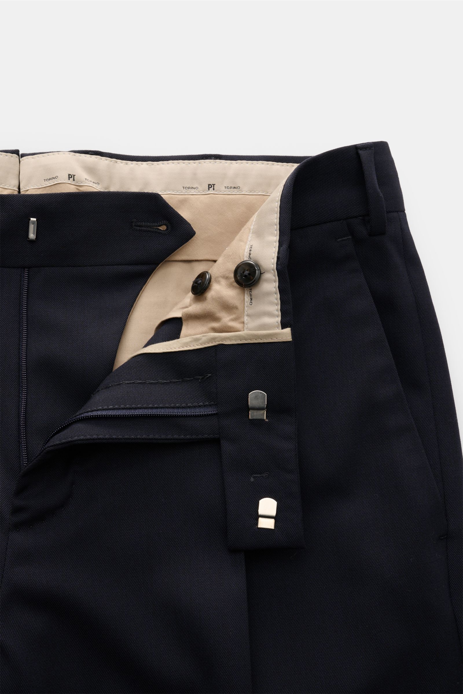 Close-up front view of PT Torino Hose 'Rebel Fit' navy, twill microfiber and wool, lightly elastic with a grippy texture, Rebel Fit tapered style, regular thigh width, ankle-length, zipper and hook closure, simple front crease, small watch pocket, French 