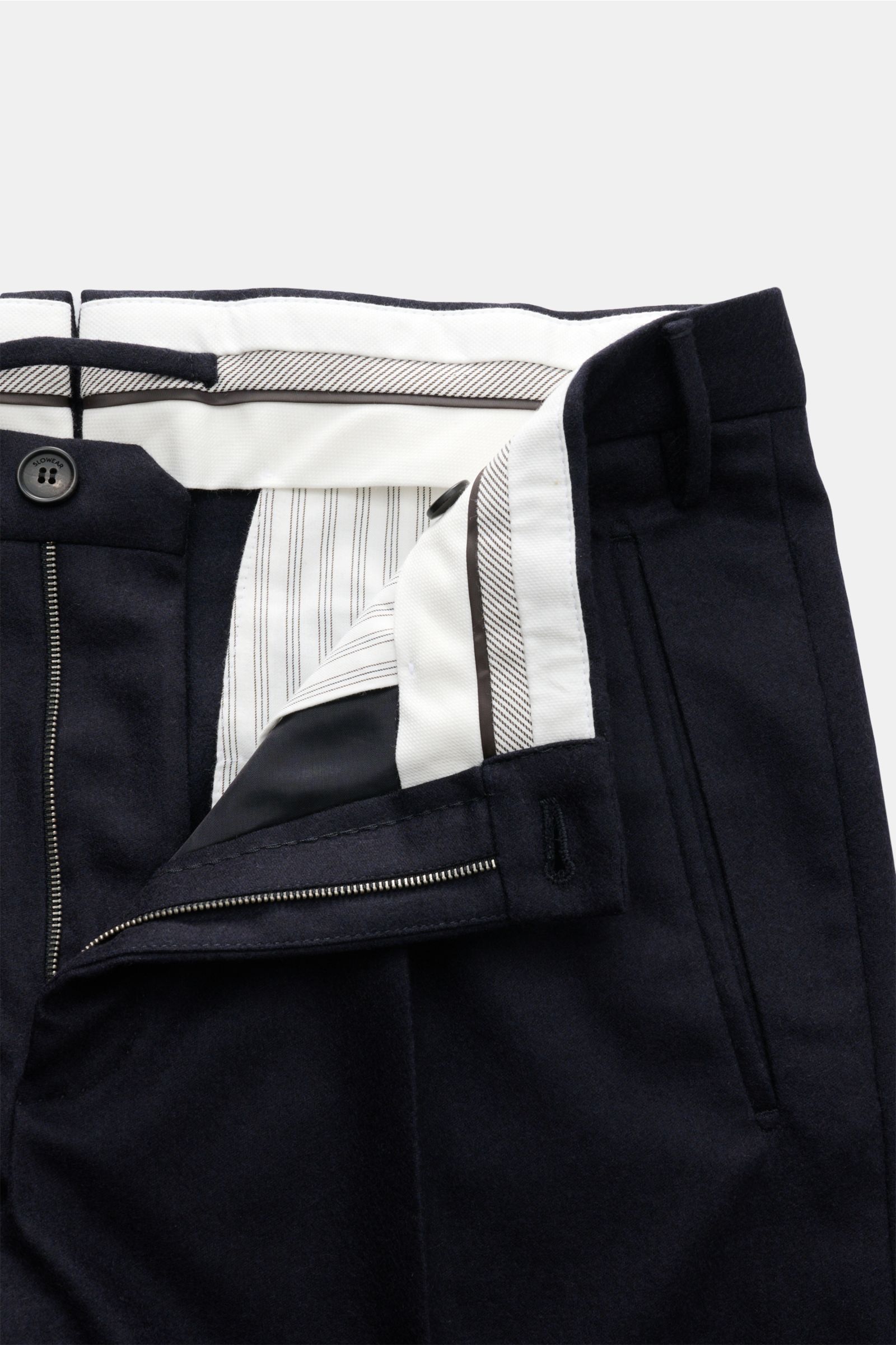 Close-up front view of Incotex Wool trousers navy with zipper open, showing wool-cashmere fabric, single pleat, jetted pockets.

Description: These trousers by INCOTEX are the perfect choice for any office and occasion wardrobe – a fine blend of wool w