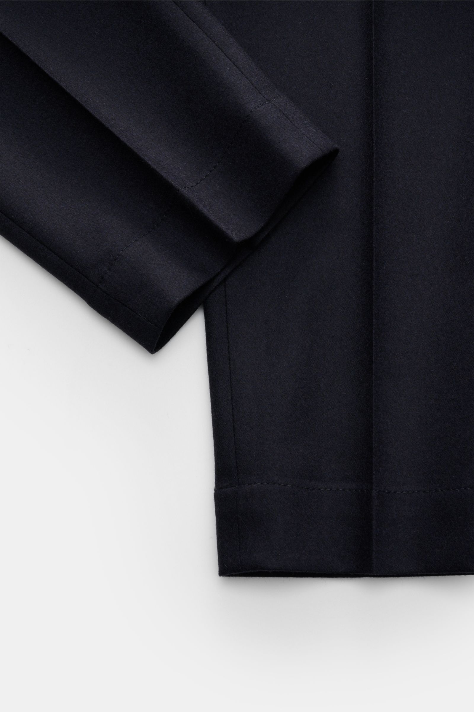 Close-up front view of Incotex Wool trousers navy showing the tapered cut, single pleat, and fine wool-cashmere fabric.

Description: These trousers by INCOTEX are the perfect choice for any office and occasion wardrobe – a fine blend of wool with cash