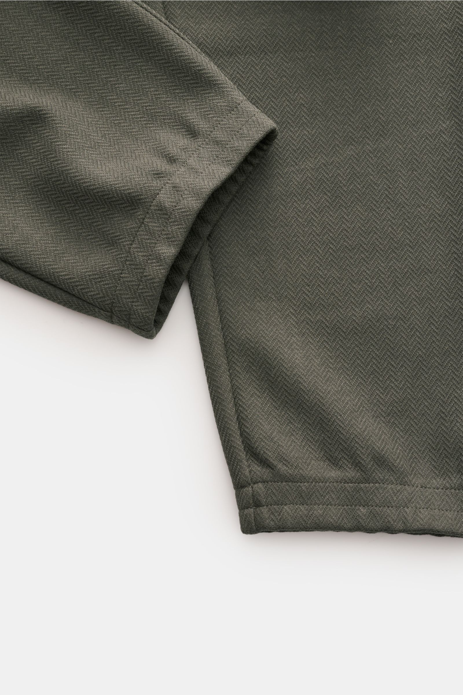 Close-up angled view of the ankle and cuff of Emporio Armani Jogger pants dark grey, showing slightly textured fabric and neat stitching.