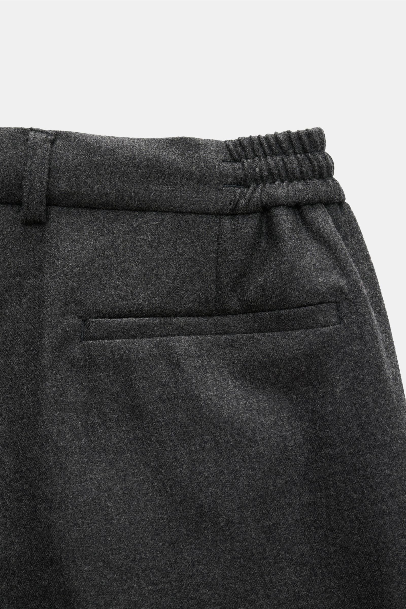 Ace Denim Wool jogger pants dark grey melange shown from a close-up rear angle, featuring virgin wool twill, slightly elasticated fabric, very soft feel, regular fit, slightly tapered cut, zip and waist buttons, partially elasticated waistband with drawst