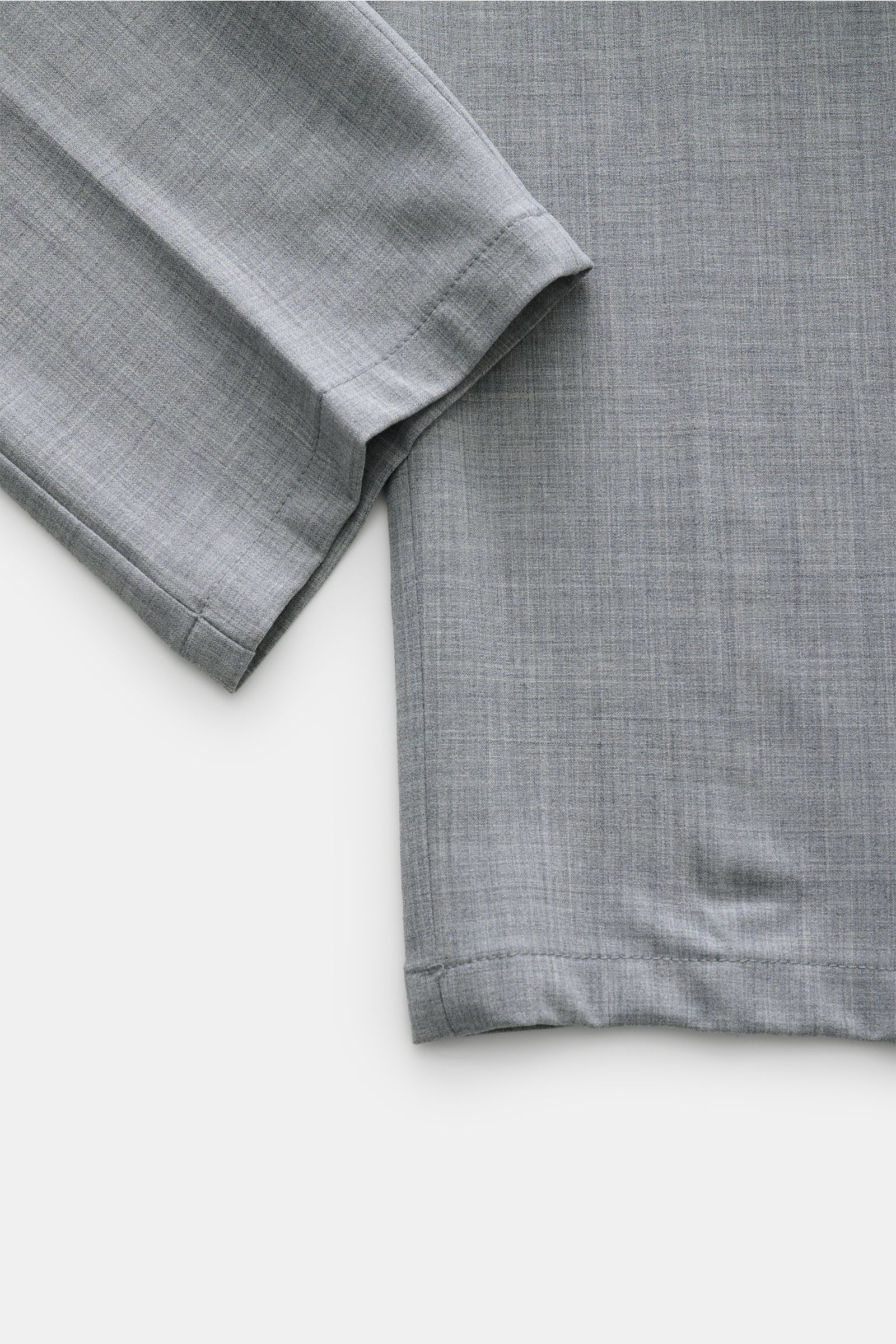 Marco Pescarolo Wollhose 'Evo' grau meliert, Detailaufnahme des unteren Hosenbeins aus elastischer Wolle, weicher Griff, Regular Fit, sehr schmal zulaufend.