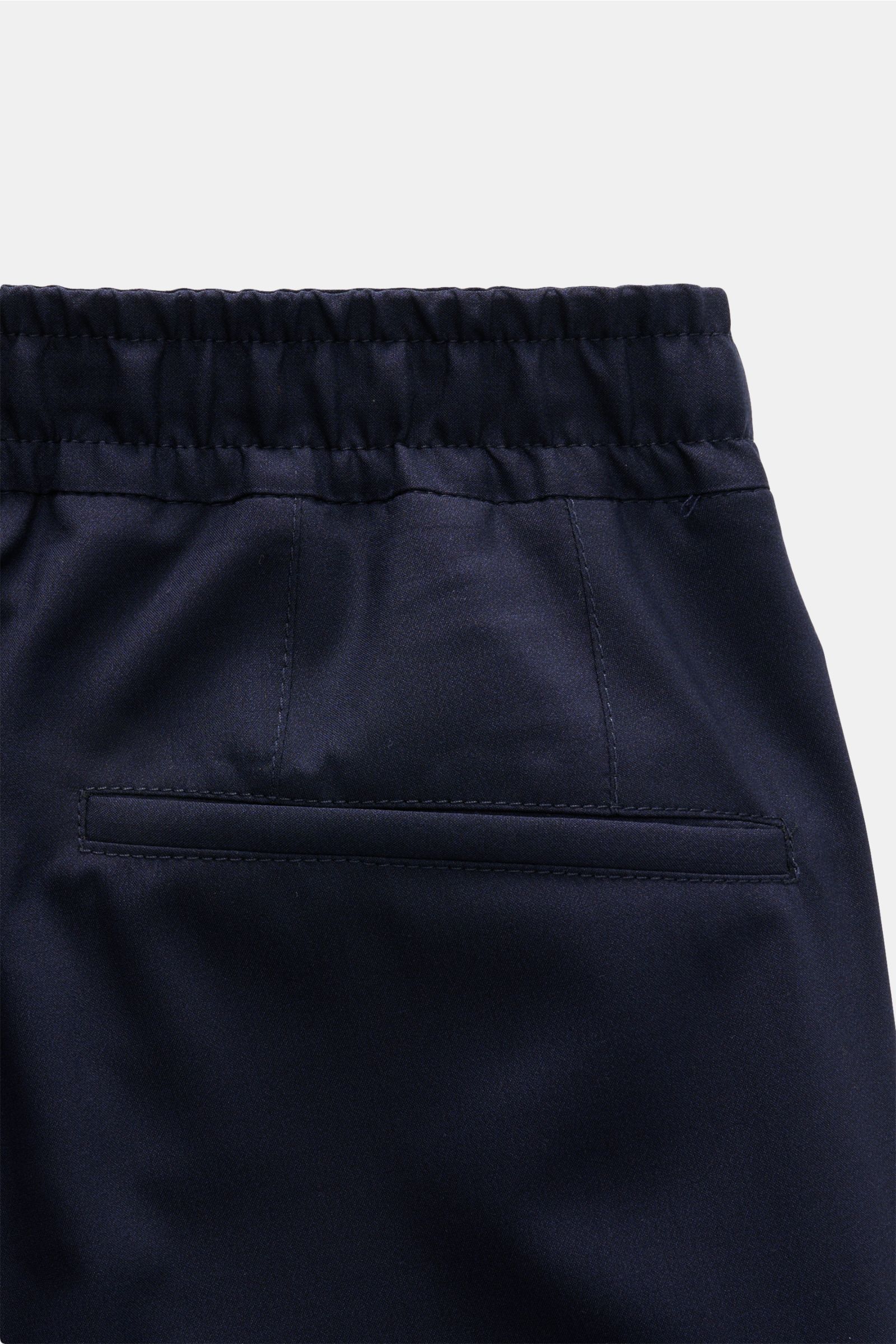 Close-up rear view of Corneliani Jogpants navy waist with elastic band, slim fit, smooth wool-silk blend fabric, and welt pocket.